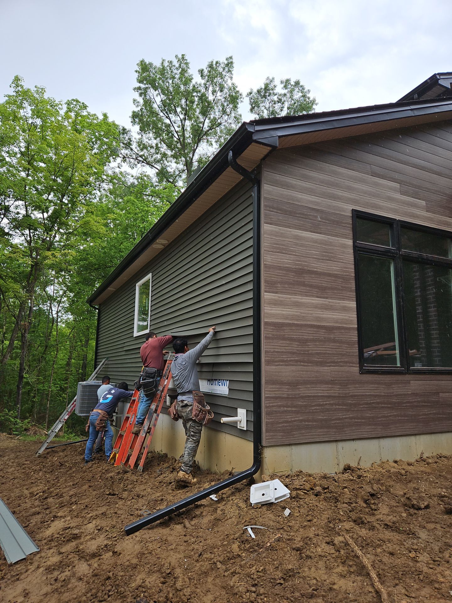 Gutter Installation using 5" Seamless Gutters and Downspouts by RoofX 