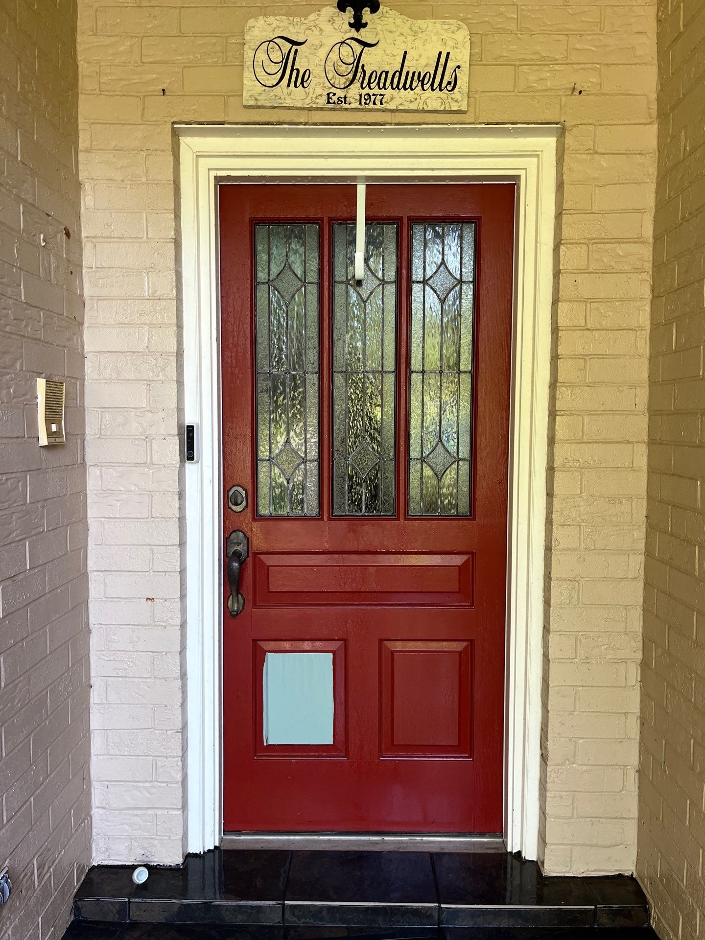 Exterior Painting in Tyler, TX | Brick House with White & Blue Finish by Quality Coats Painting