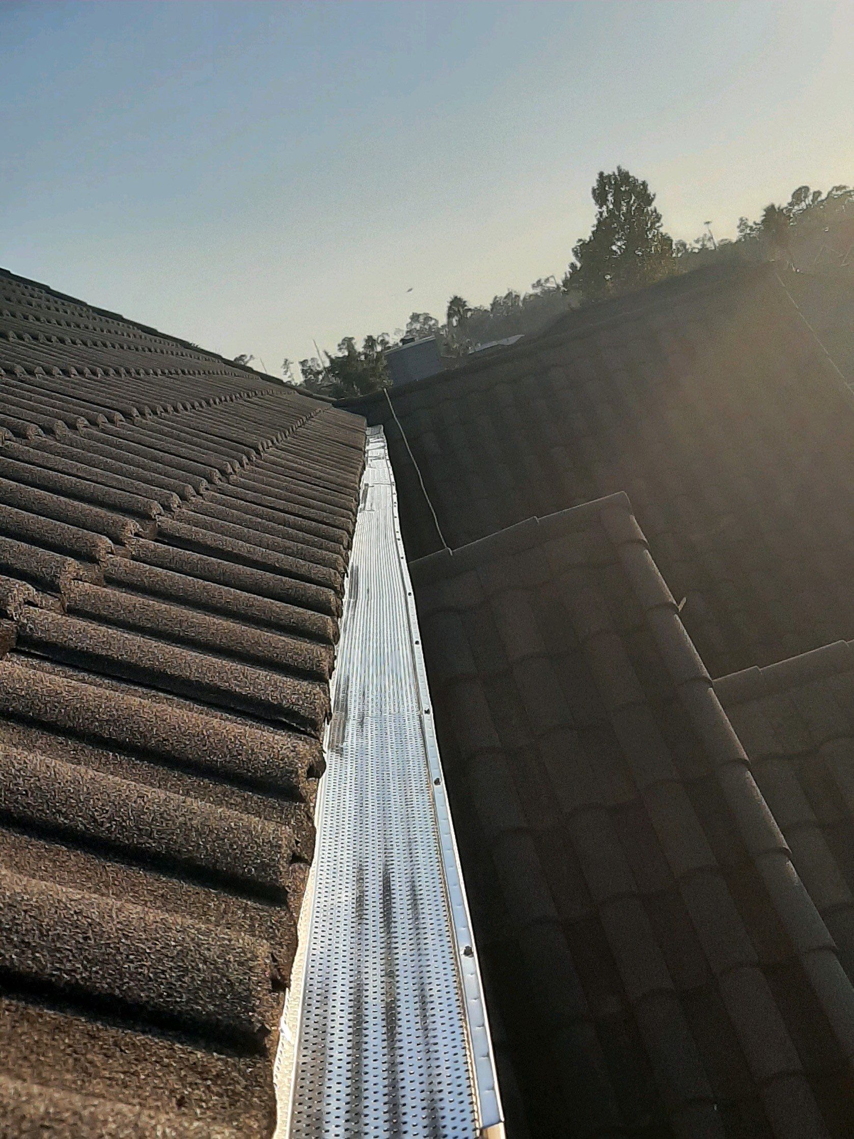 Seamless Gutter Installation with Wicker Color K-Style Gutters and LeafBlaster Pro Mesh Gutter Guards by Gutter Professors