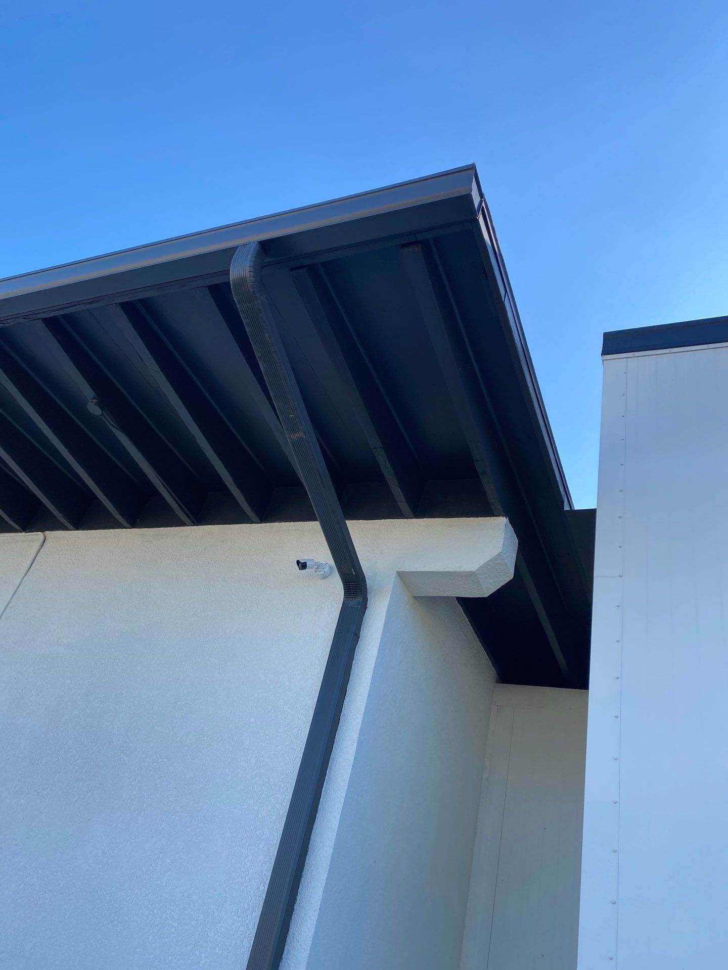 Black Seamless Gutters for Modern Homes in Sarasota FL by Gutter Professors