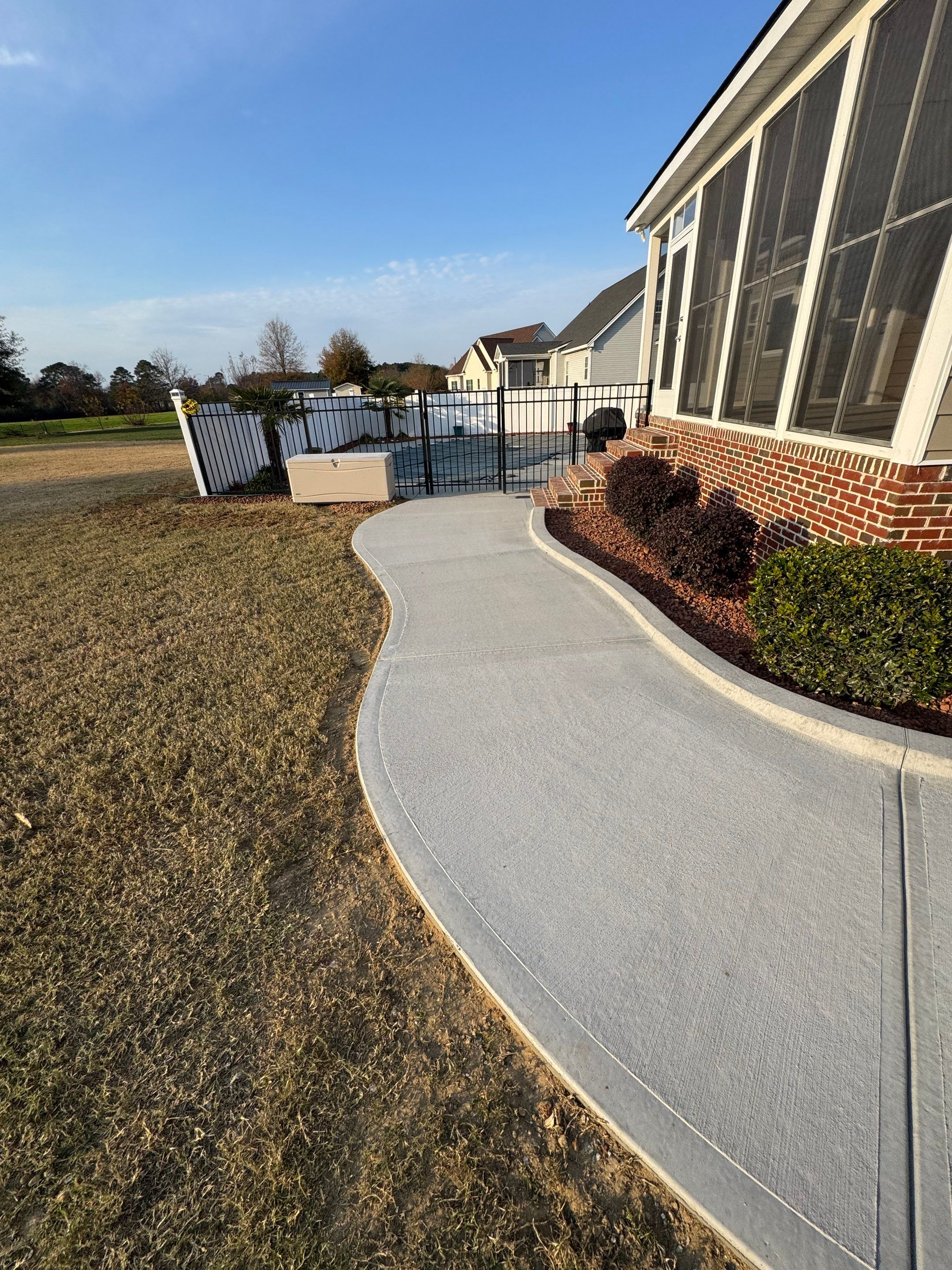 Custom Screened Porch and Concrete Walkway Installation in Rocky Mount by The Remodeling Company