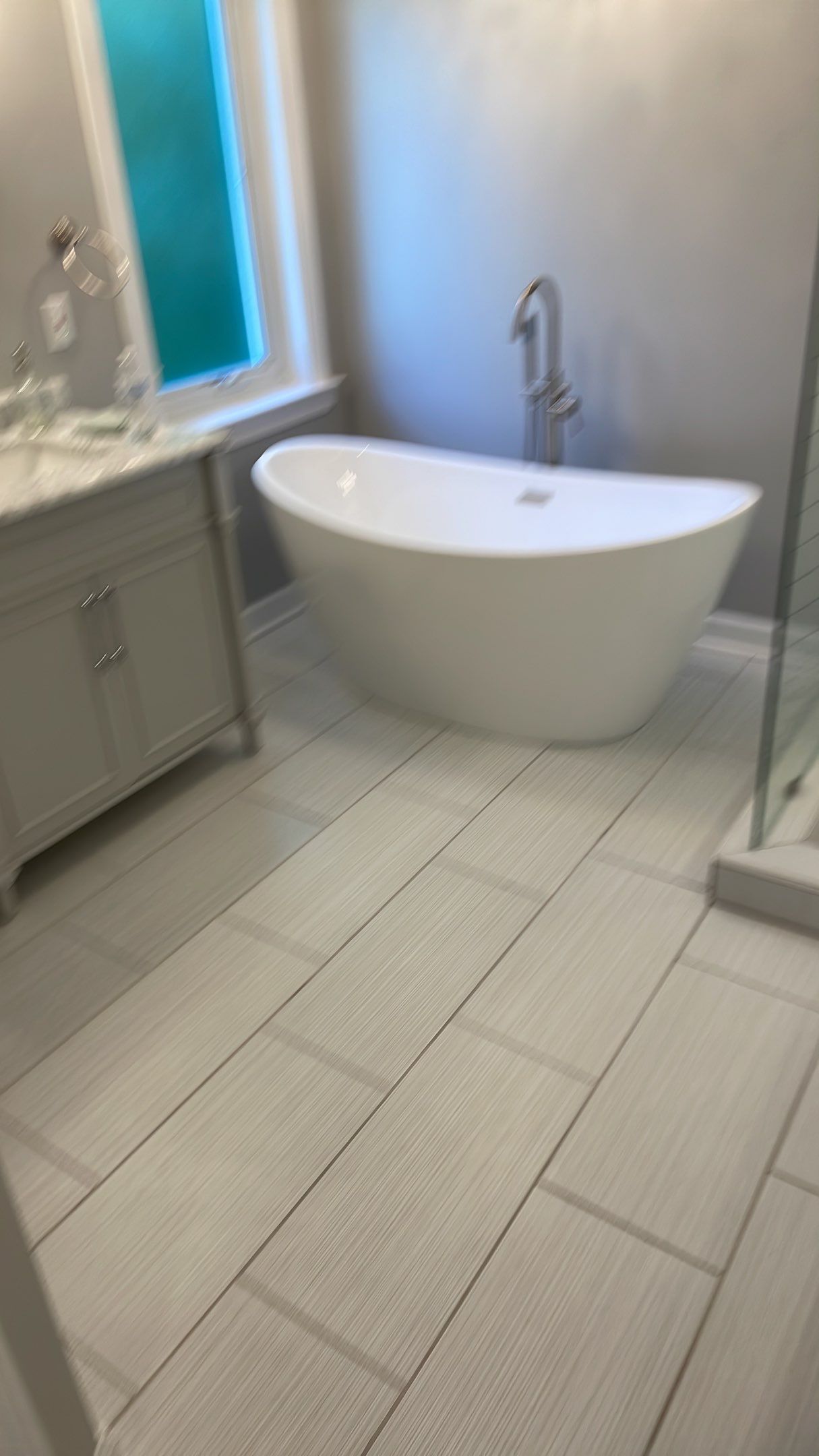 Bathroom Remodel using Schluter by Footprints Floors of Coastal Carolina