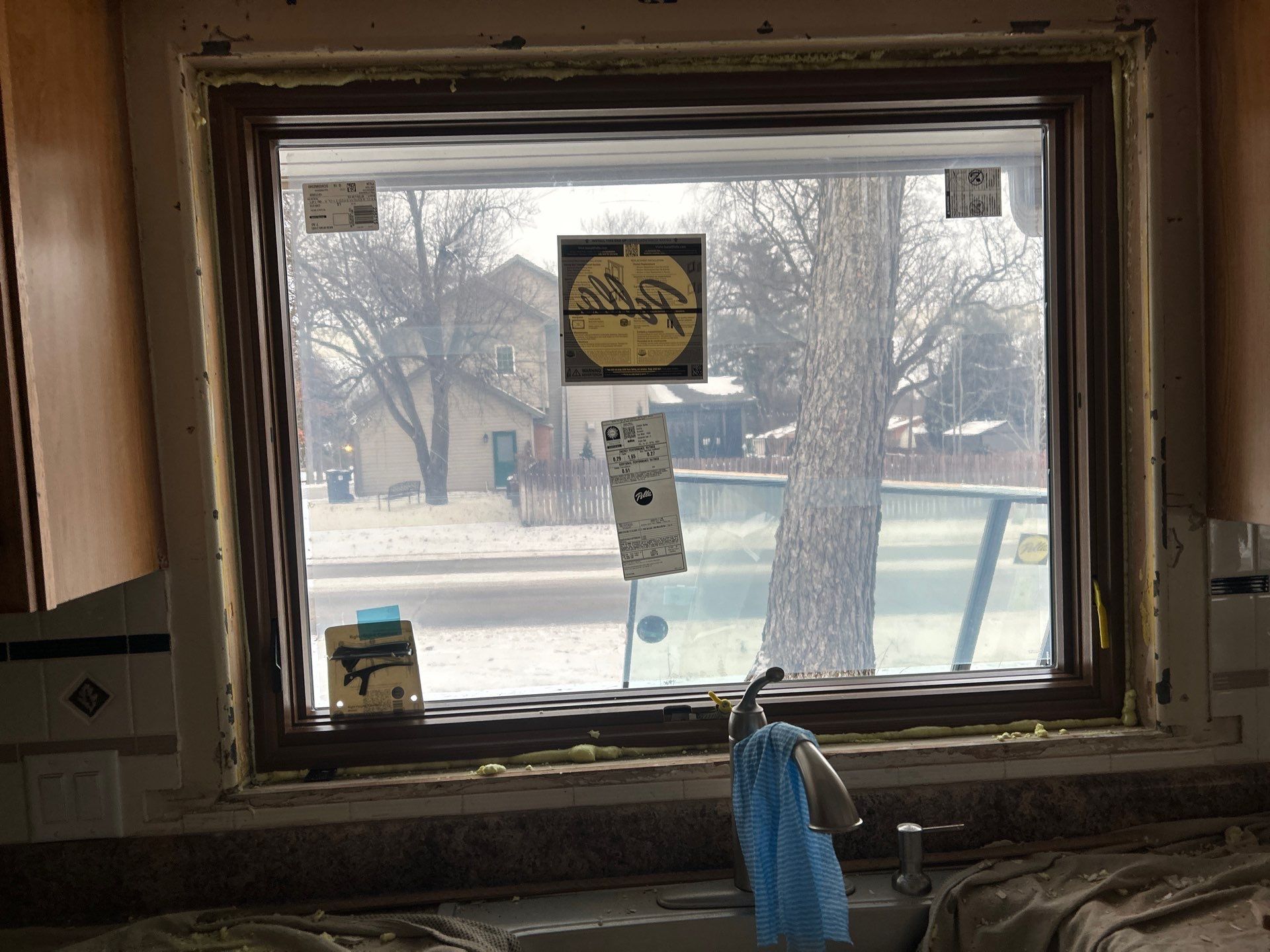 Black-Frame Pella Lifestyle Upgrade on a Partial Brick Home by United Windows and Siding LLC