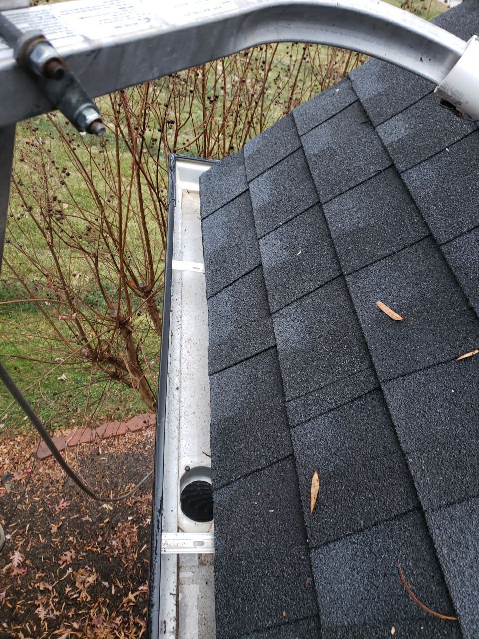 Gutter Cleaning using water by Power Wash Masters LLC
