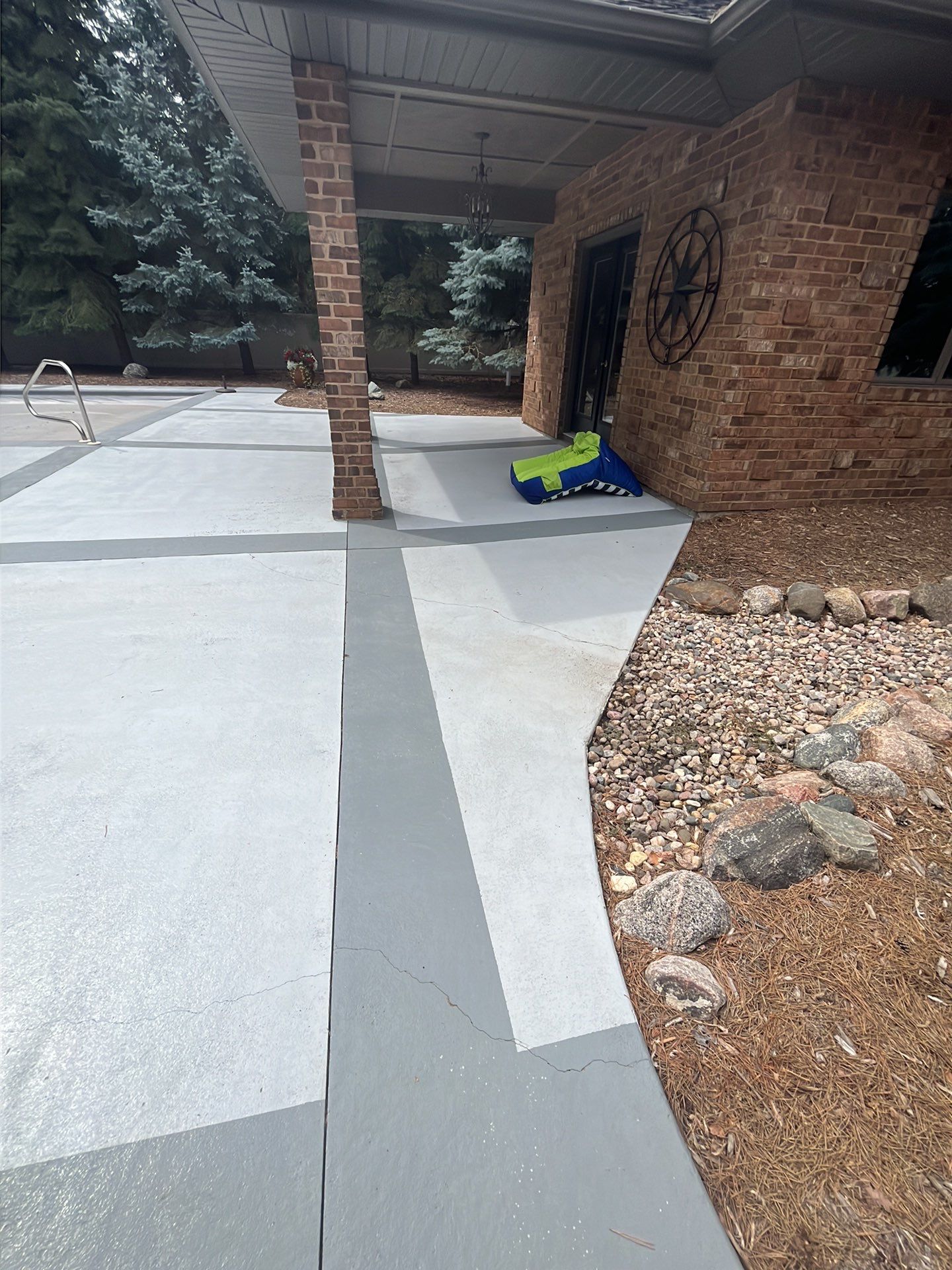Decorative Concrete Pool Deck and Patio Resurfacing in Sioux Falls by Select Painting, Coatings & Garage Cabinets
