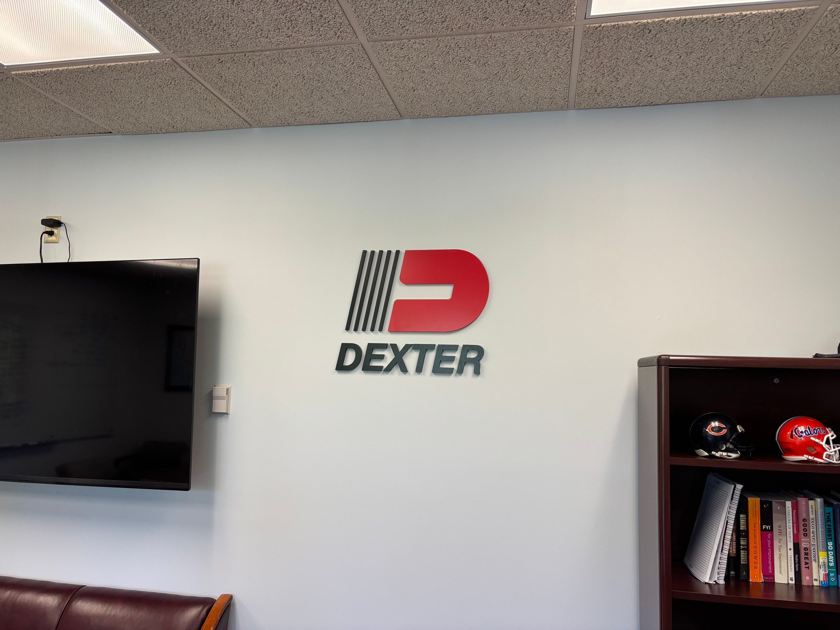 Custom Interior Signage and Logo Branding for Elkhart Executive Office by Hayes Design co