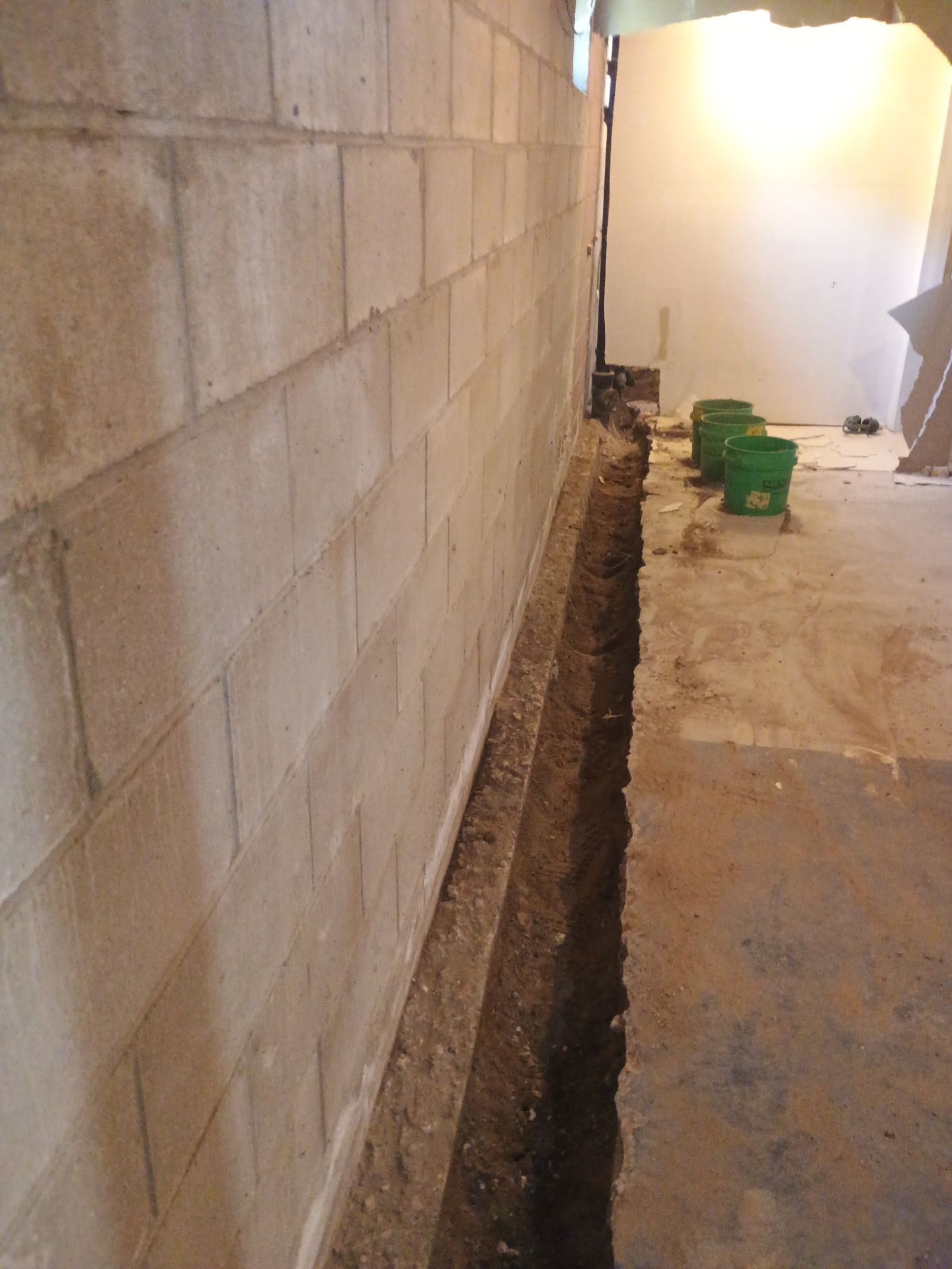 Interior Drain Tile & Buried Discharge in South Minneapolis by Waterproofing Northeast