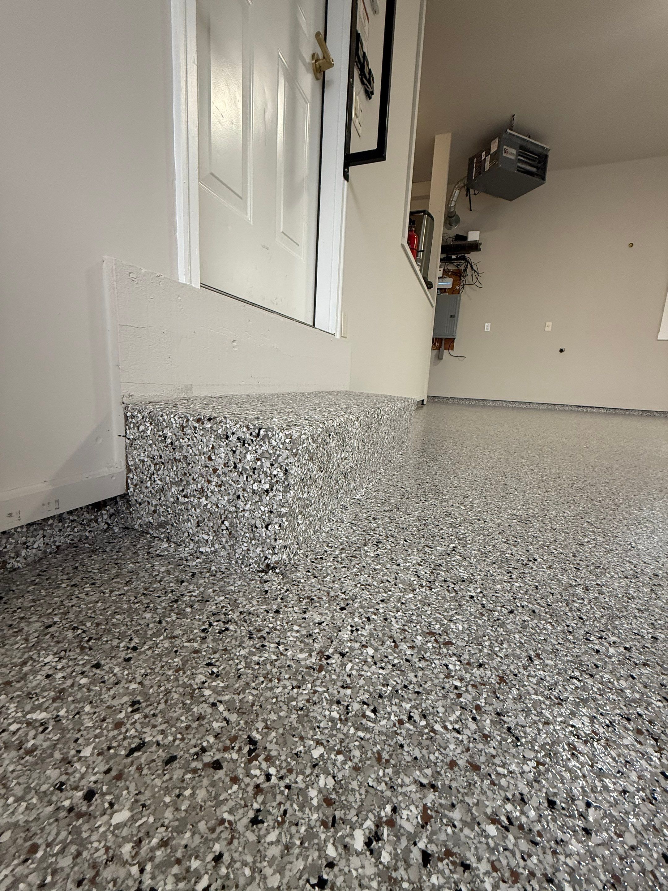 Garage transformation in Yankton by Select Painting, Coatings & Garage Cabinets