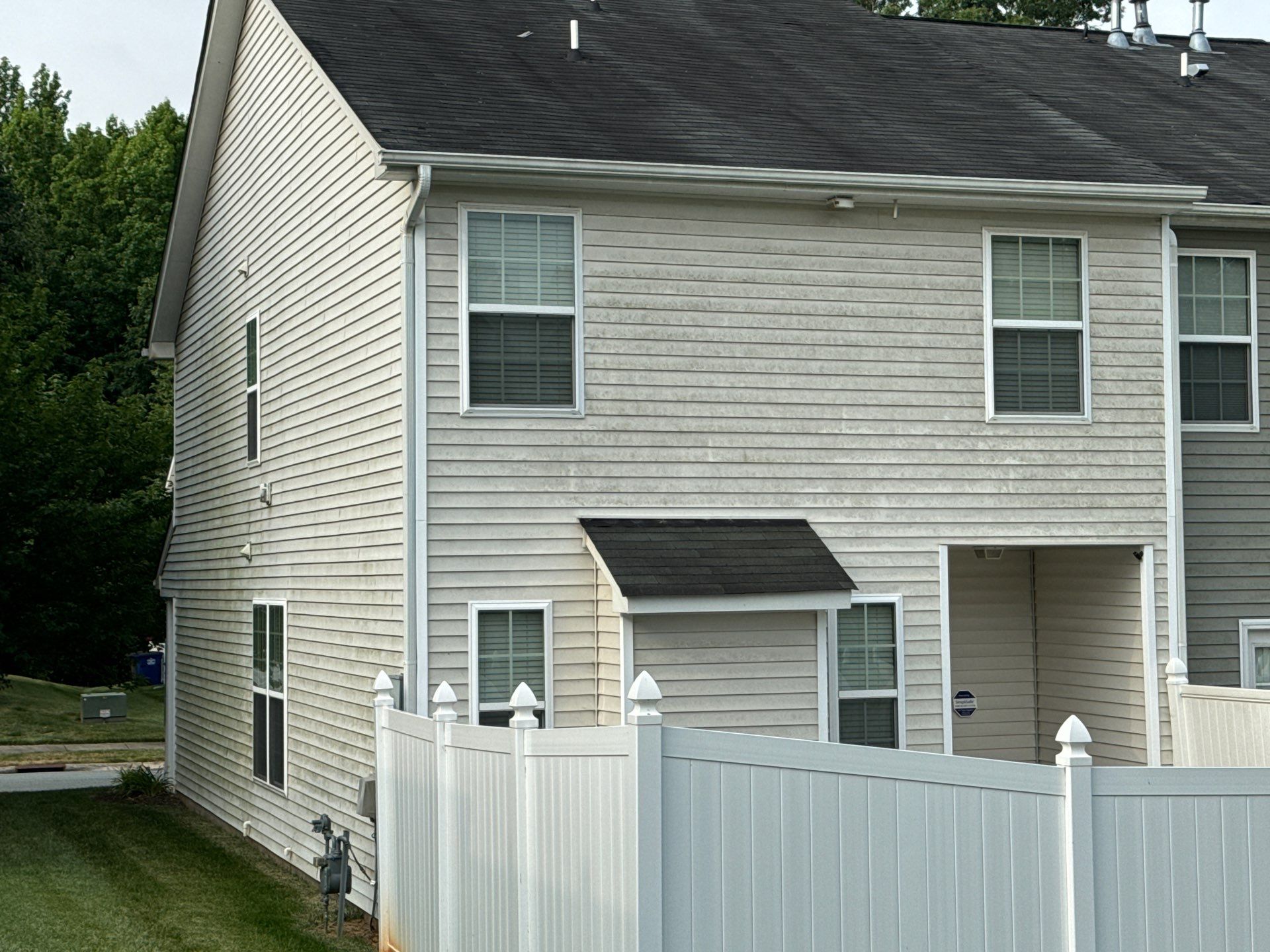 exterior house cleaning including vinyl siding and possibly the fenced area using pressure washing equipment