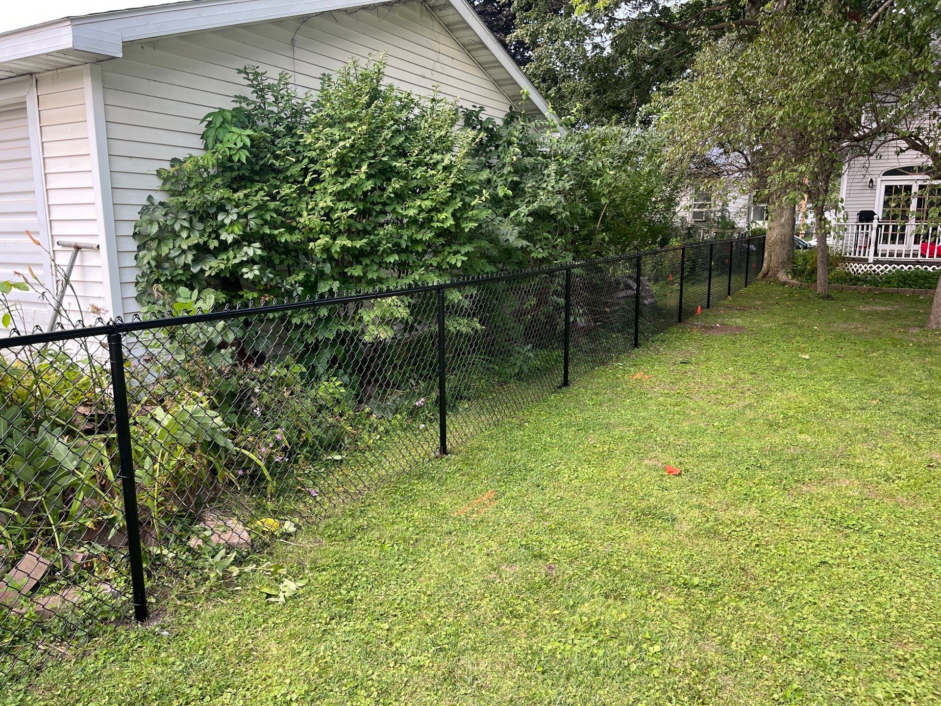 Black Chain Link Perimeter Fence and Gate Installation in Shell Rock by Perfect Picket Fence and Stain