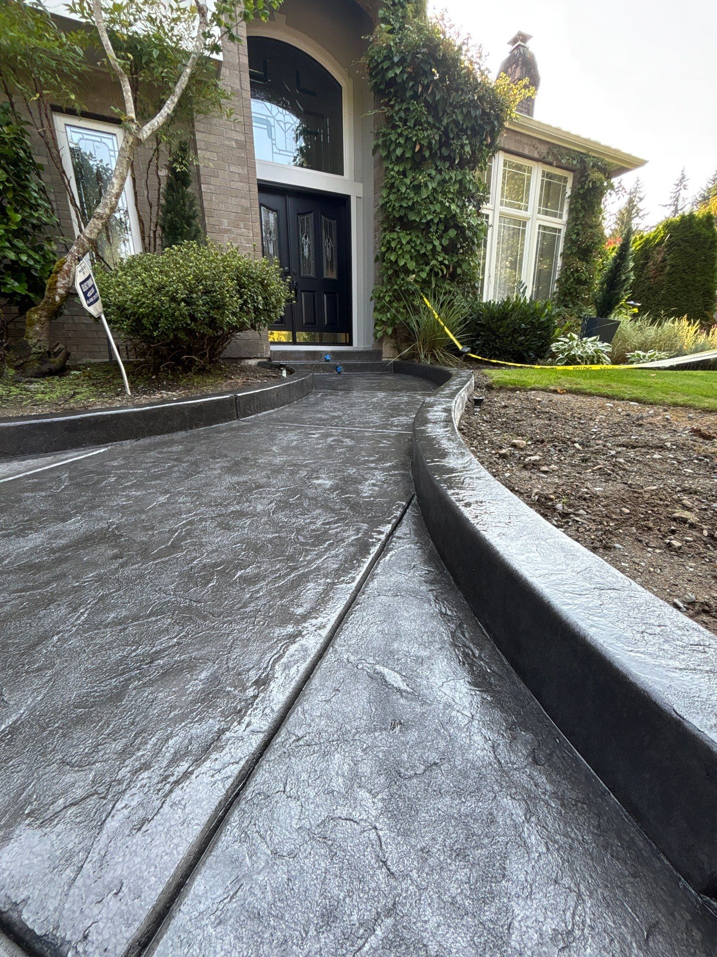Multi-color Stamped & Sealed Concrete Driveway Renovation | Mukilteo by Jireh Asphalt & Concrete Inc