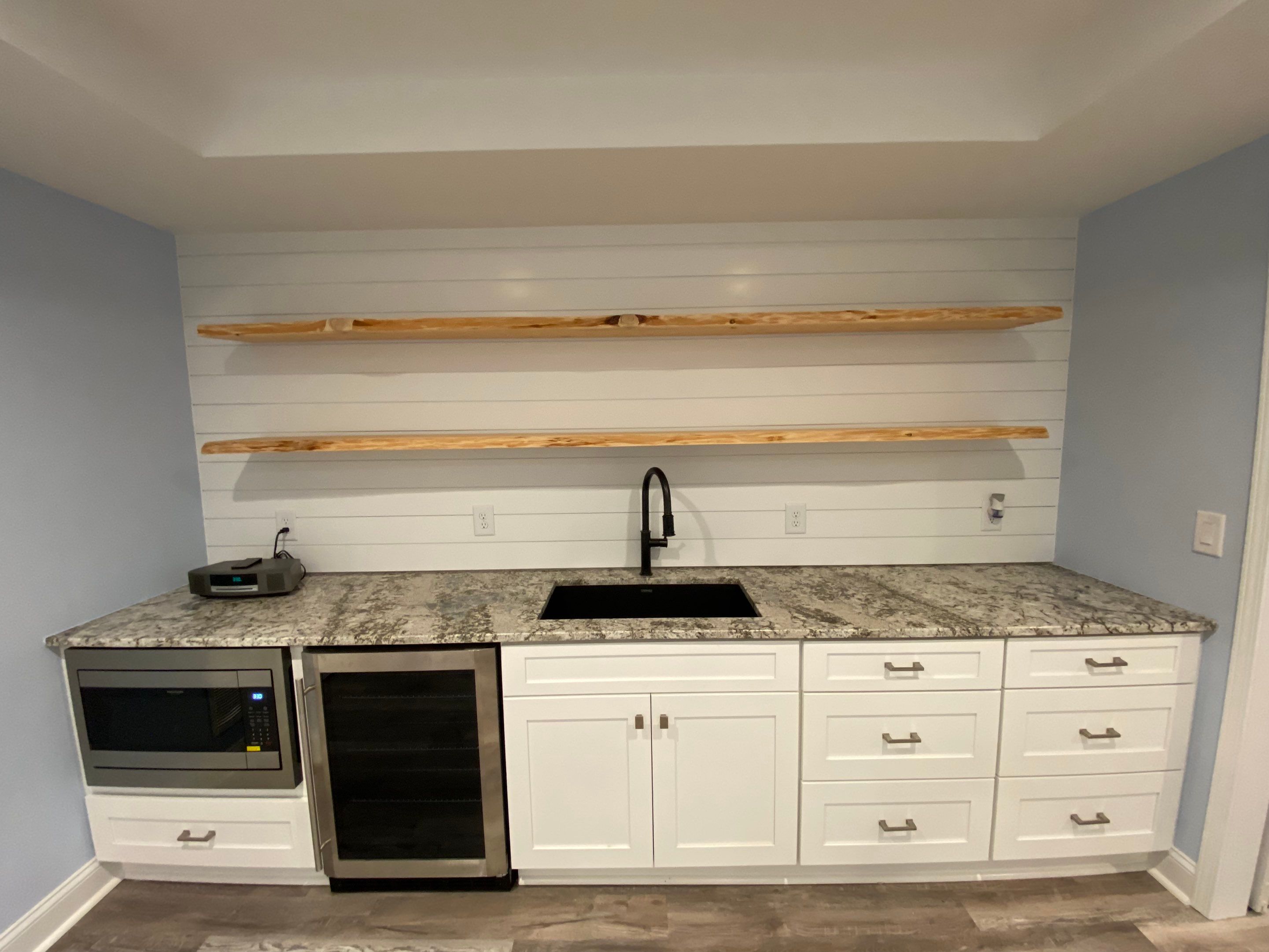 Marietta Basement Remodeling Featuring Custom Wet Bar and Marble Shower by Swift Home Renovations