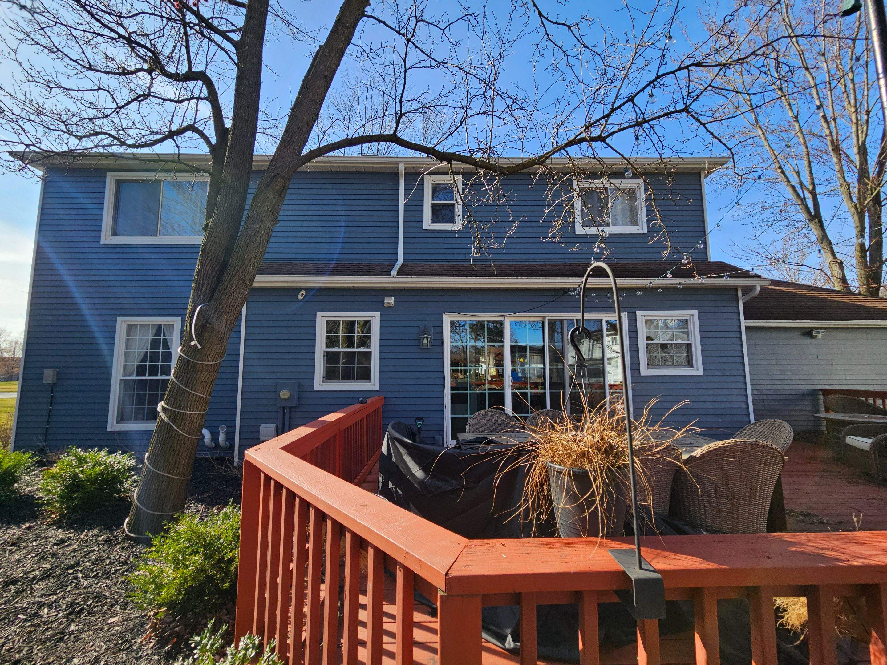 Vinyl Siding w. Stone Facade by Absolute Roofing and Construction