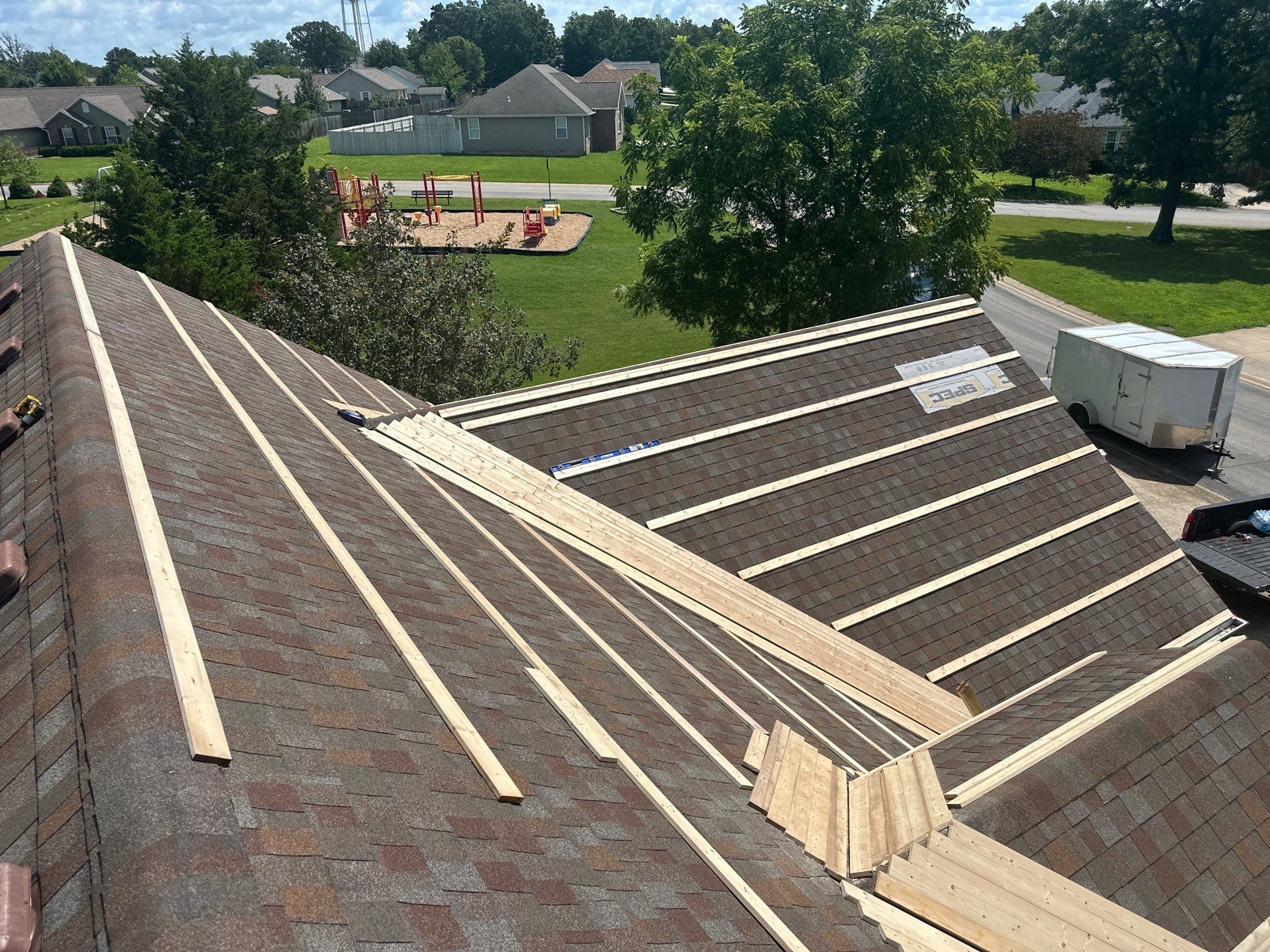 Residential Roofing Install - Copper 29 Guage G-Rib Metal & 6" Inch Seamless Gutters + 3"x4" Aluminum Downspouts  by Titan Commercial & Residential Roofing 