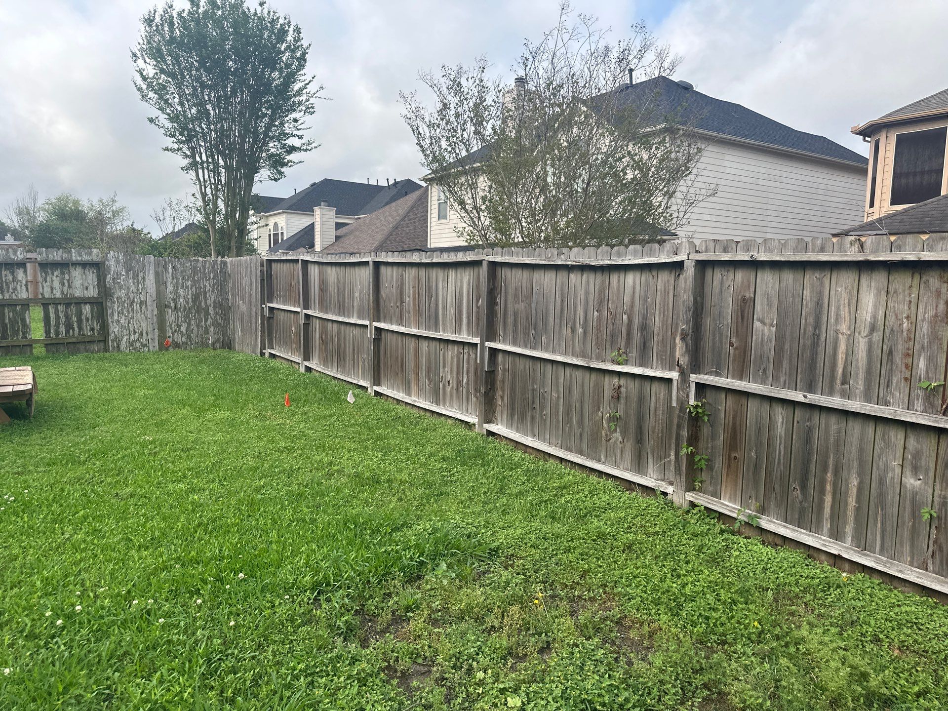 Wood fence with alternating panels by Tim's Fences