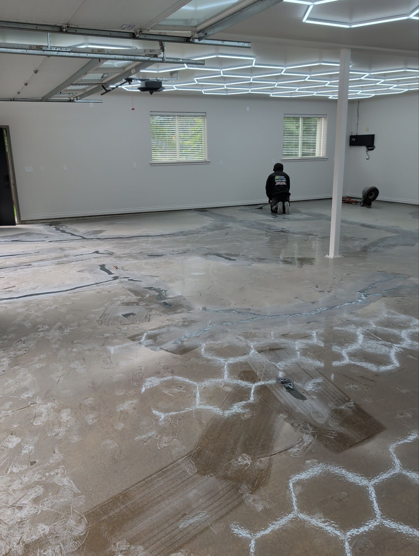 Custom Garage Transformation with Polyaspartic Coating and Hexagonal LED Lighting by Croc Coatings, LLC