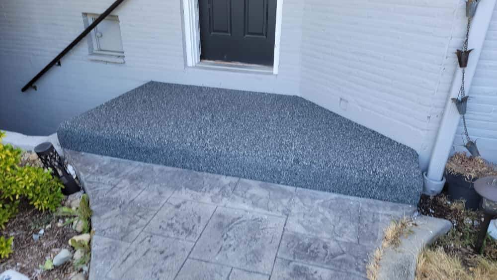 Charming Compact Patio in Vuba Stone by Concrete Coating Experts Inc.