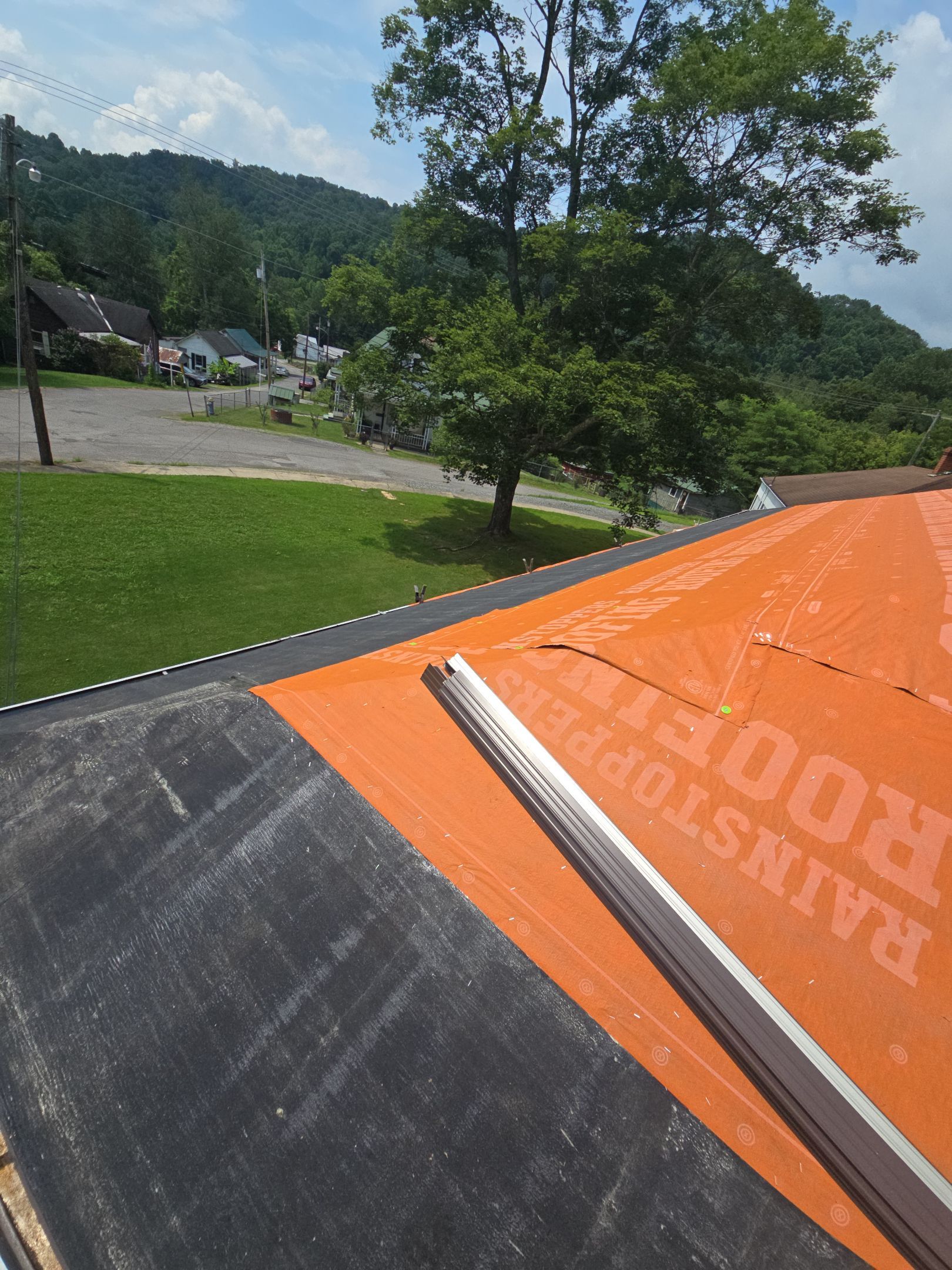Residential Roofing Installation using GAF TImberline HDZ Hickory by Rainstoppers Roofing