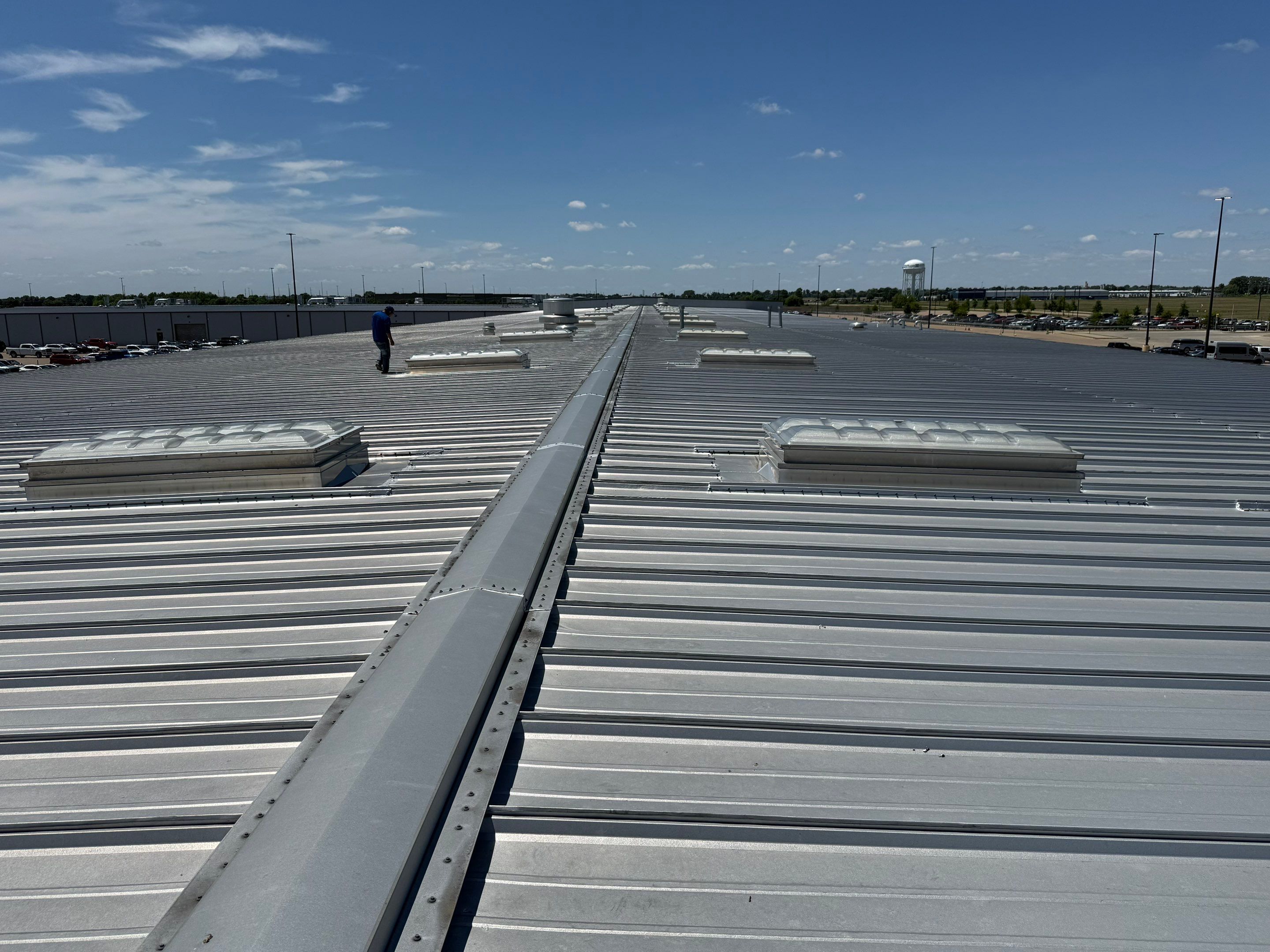 Commercial Metal Roof Repair and Skylight Sealing in West Memphis by Revival Roofing Services