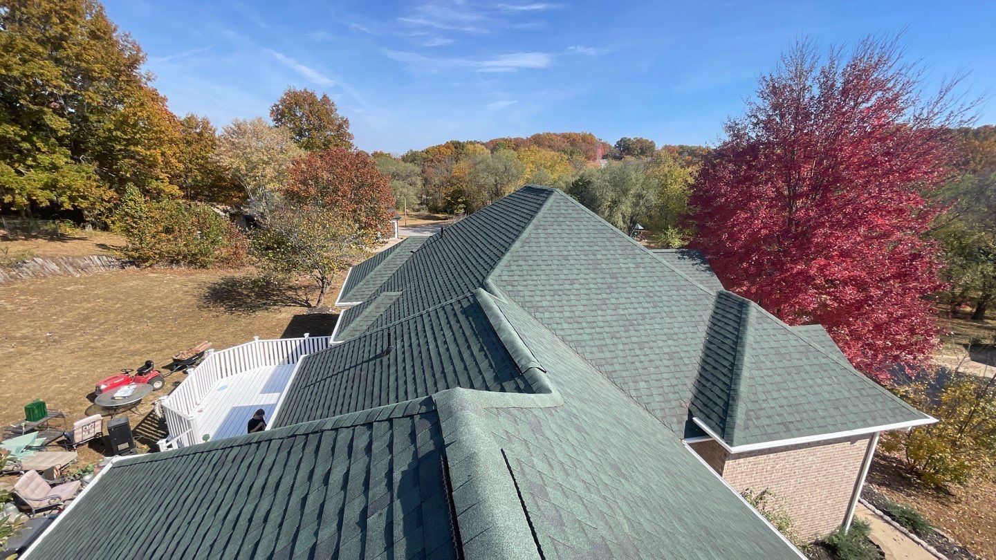 Residential Roofing Install - Green Atlas Pinnacle Pristine Shingles - White Gutters & Downspouts  by Titan Commercial & Residential Roofing 