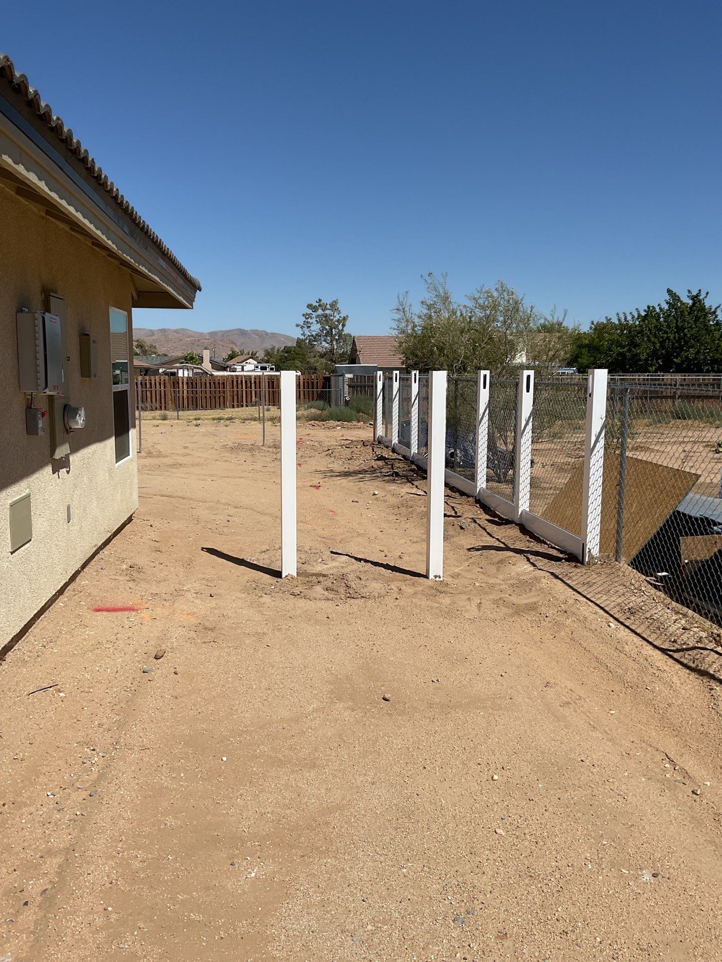 6ft White Privacy Vinyl Fence with Chain-link Fence by Fence Guys Inc.