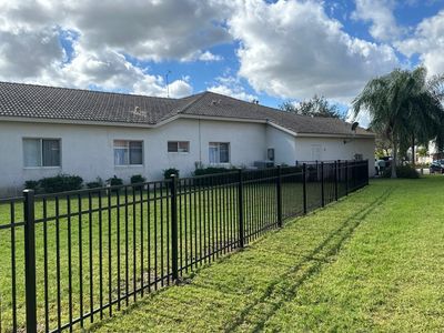 Aluminum Fence Installation using Black 3 Rail Aluminum Fence