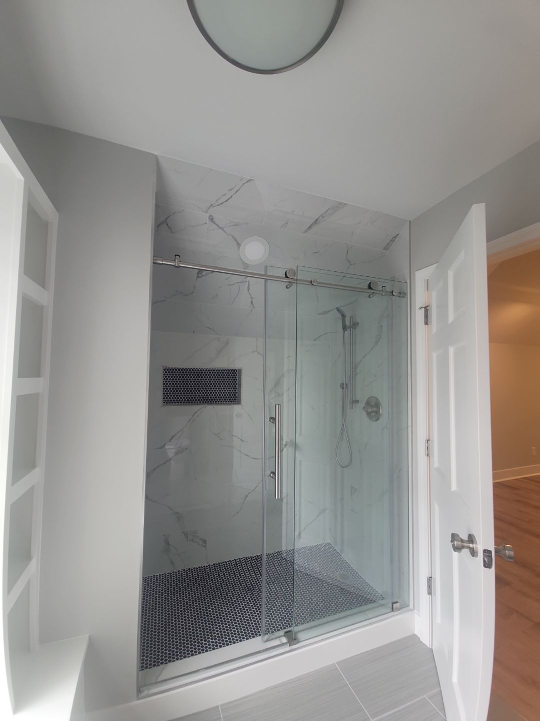 From Rafters to Retreat: An Attic Transformed with a Luxe Bath Escape by Elite Remodeling and Design LLC