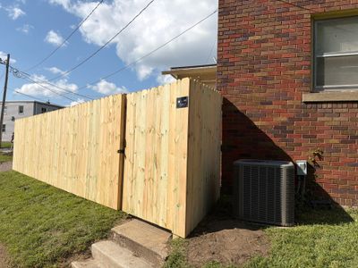 New Treated Wood Privacy Fence and Metal-Framed Gates