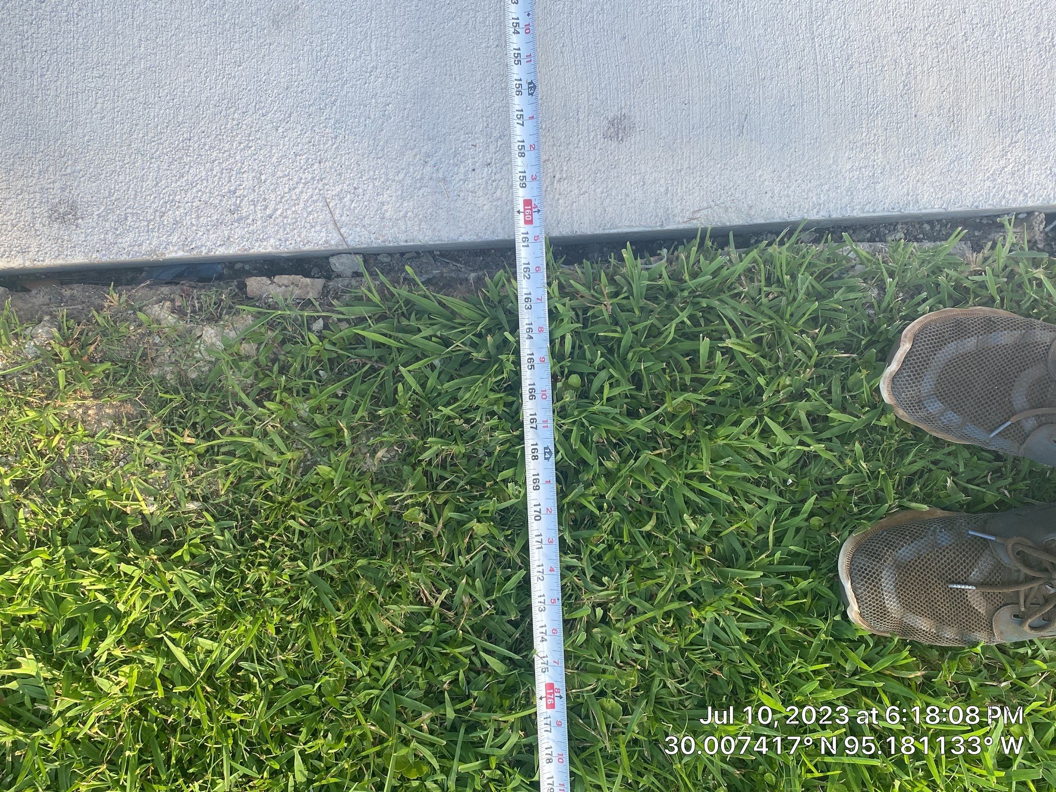 Complete metal driveway gate install with solar powered opener. Metal fence frame with Cedar Pickets by Astro Outdoor Designs 