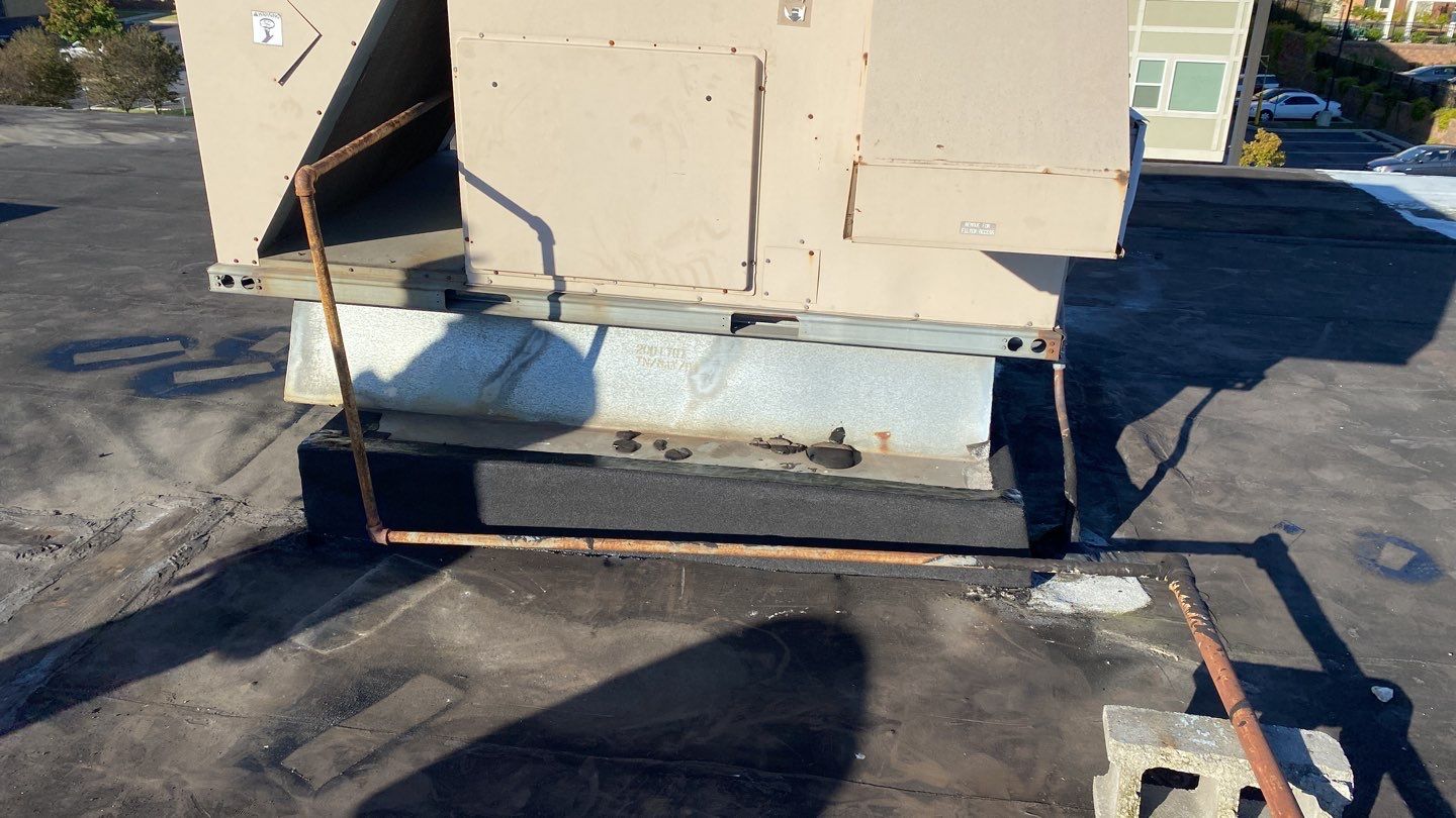 Commercial Roofing Repair using new Flashing by Alpha Design Services