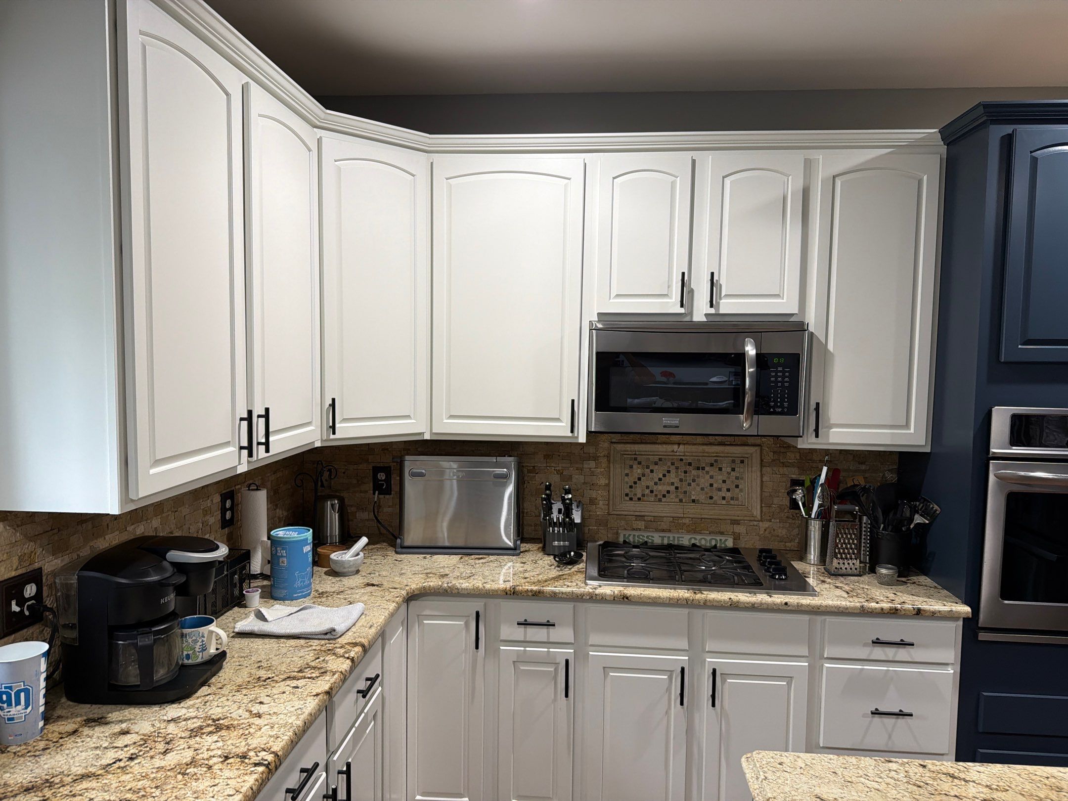 Kitchen Cabinet Refinishing by Top Shelf Painter