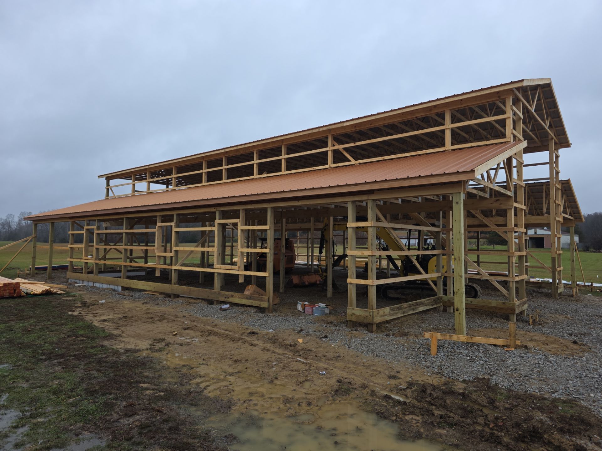 Custom Pole Barn Home with Charcoal Siding and Copper Roof by The Barn Builders