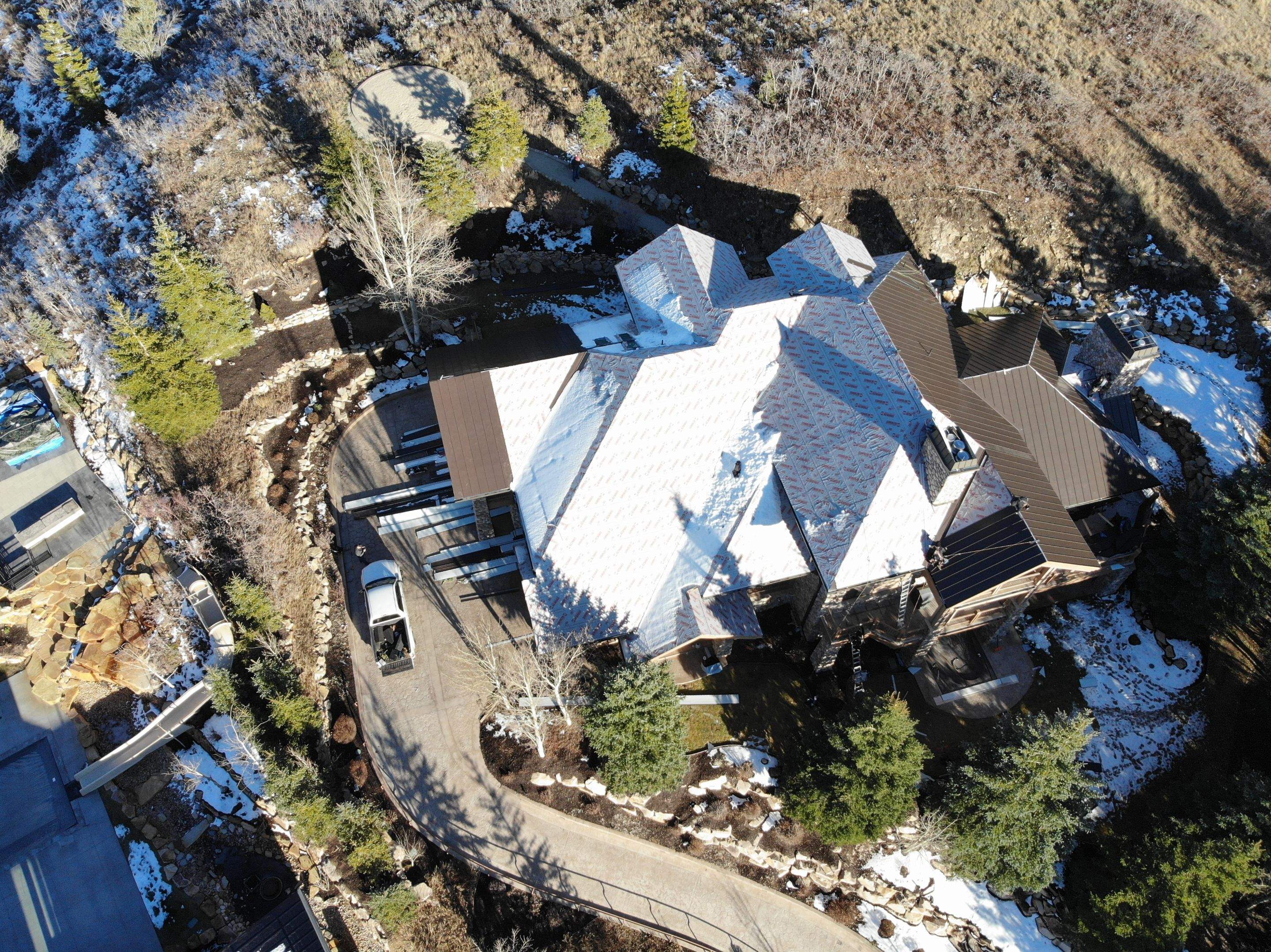 Standing Seam Metal Roof Replacement After Snow Damage by ASAP Roofing & Restoration