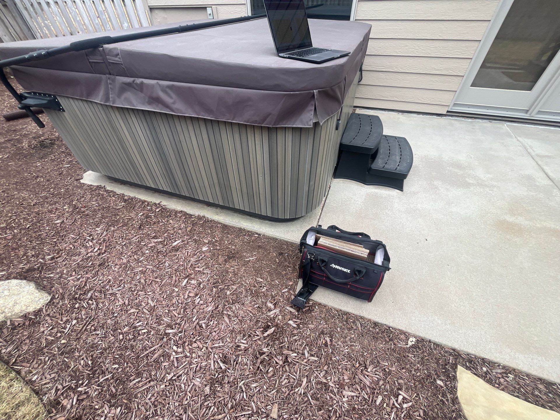 Textured Concrete Coating and Paver Patio Refresh in Sioux Falls by Select Painting, Coatings & Garage Cabinets