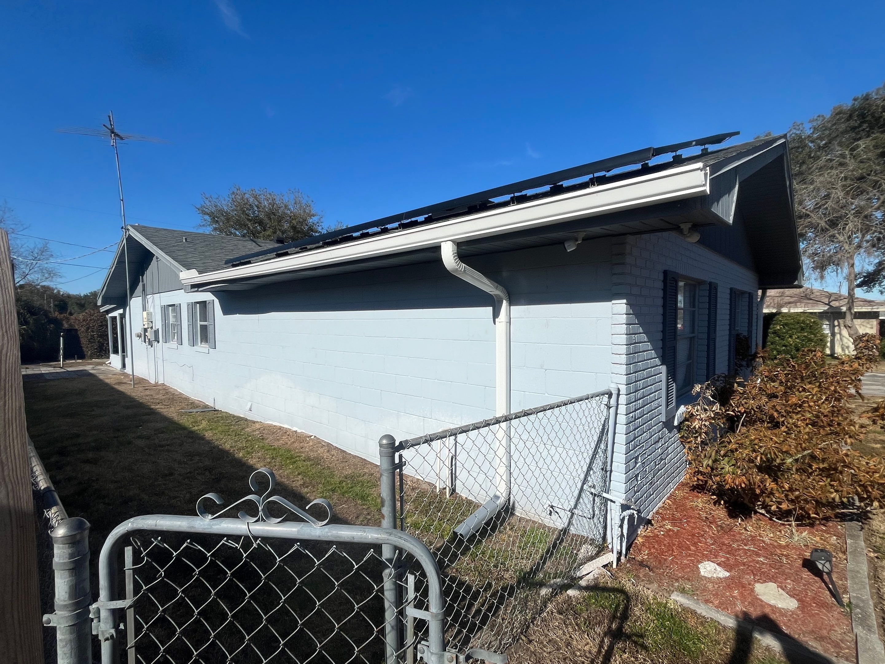 Downspout Installation using Downspout Extension and new Gutters in Winter Haven FL by Gutter Professors