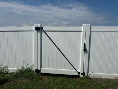 White Vinyl Privacy Fence Installation in Waterloo Iowa