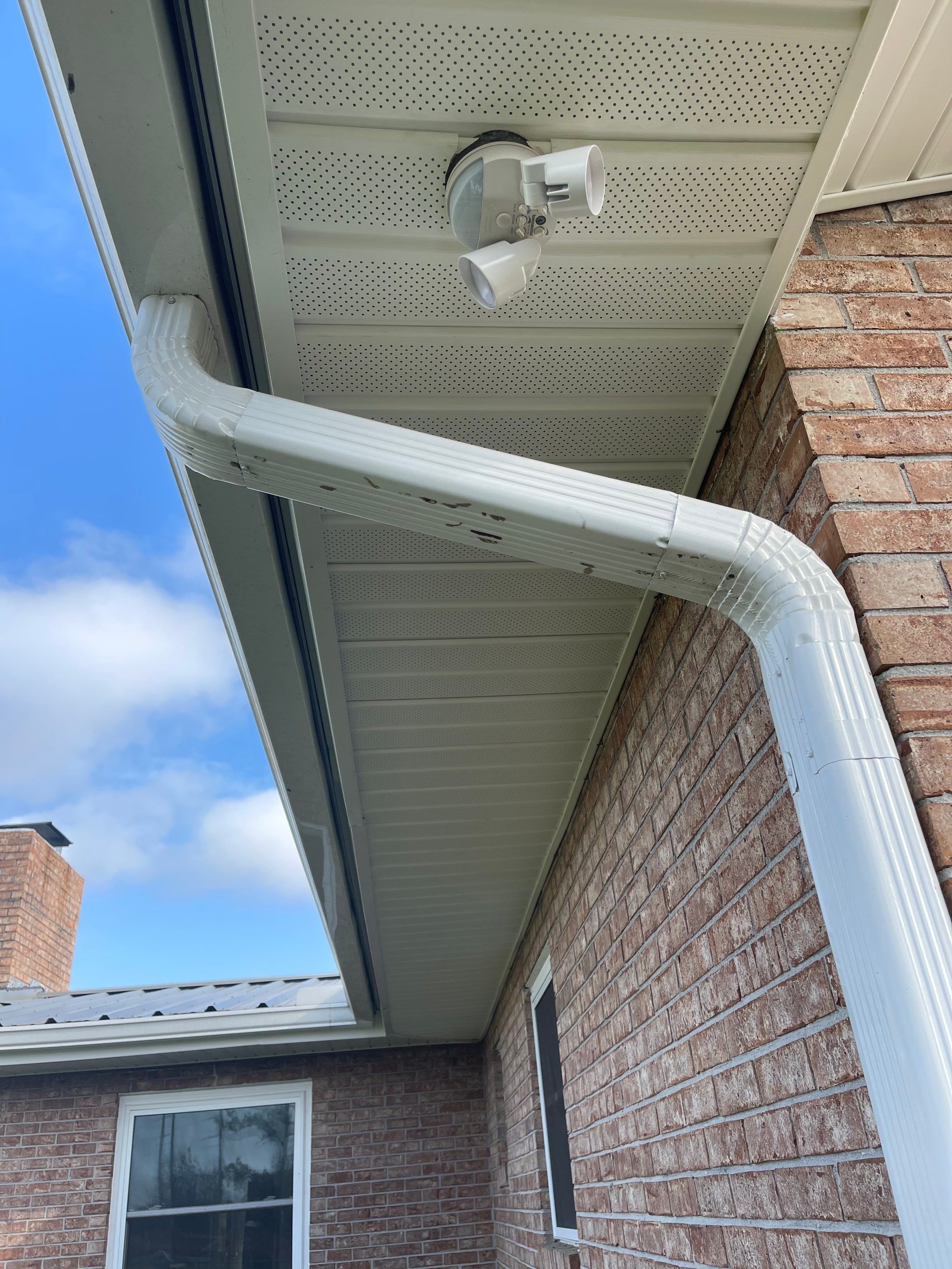 Soffit and Fascia Installation Using White Vinyl Soffit by Gutter Professors