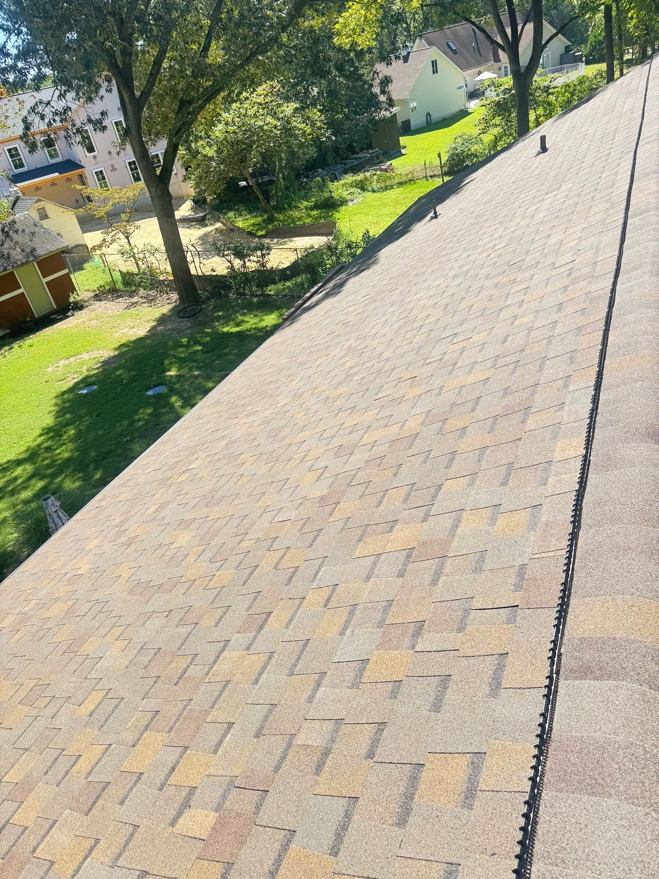 Full Roof Replacement and Gutter Guard Installation in Pasadena, Maryland by First Chesapeake Roofing