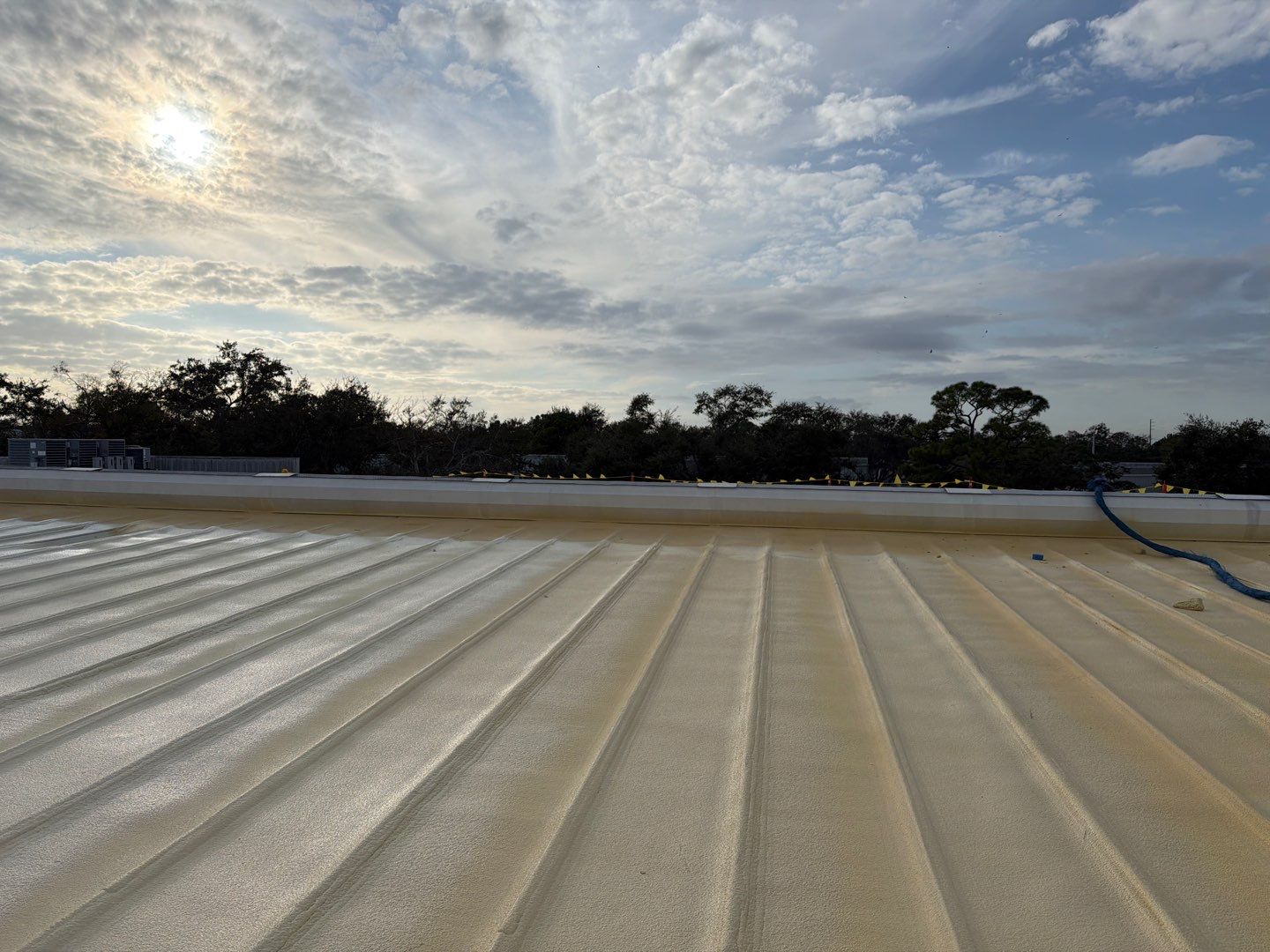 Sarasota Industrial Warehouse Metal Roof Silicone Coating Restoration by CES Roofing