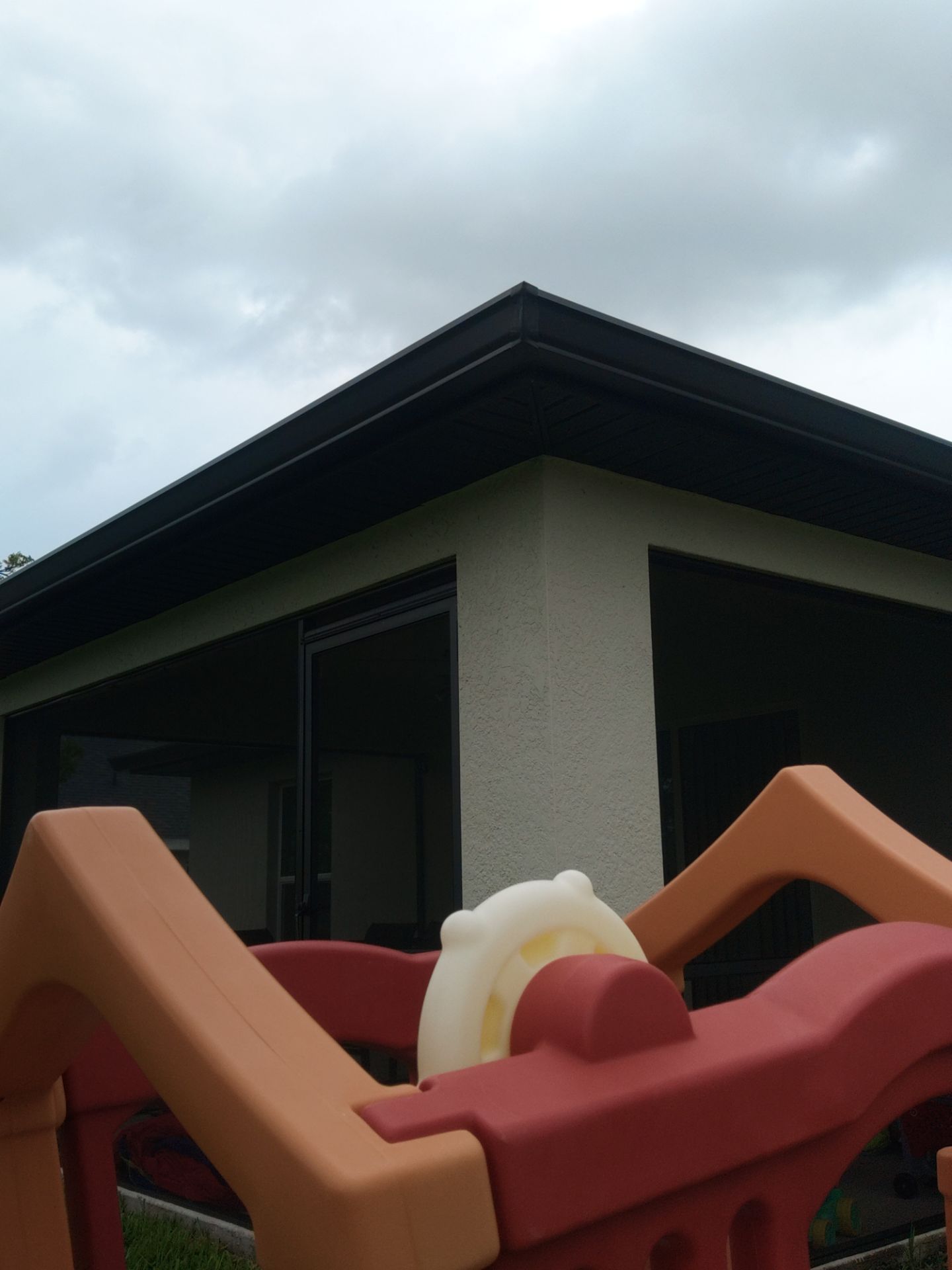 Black Seamless Gutters using black seamless gutters in Cape Coral FL by Gutter Professors