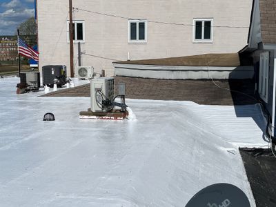 Roof Installation using Silicone Modified Flat Roof Coating
