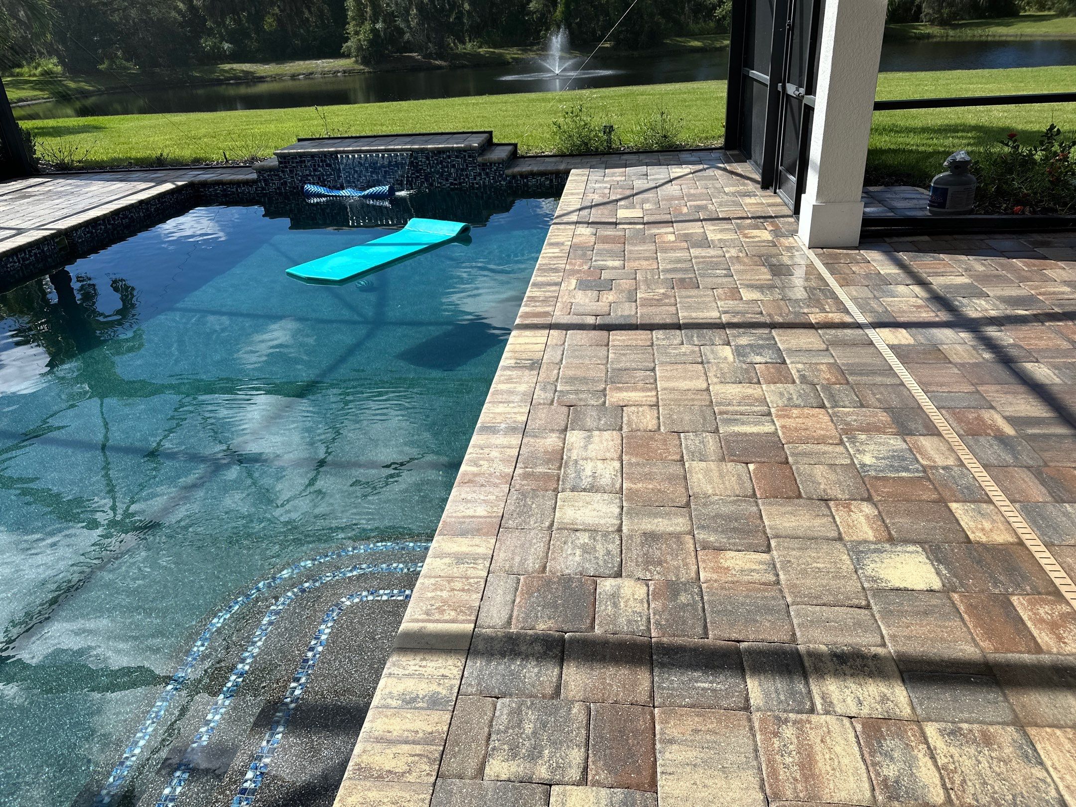 Paver Driveway, Sidewalk, and Pool Deck Cleaning in Winding River Community, Bradenton, FL by Sunshine AquaWash