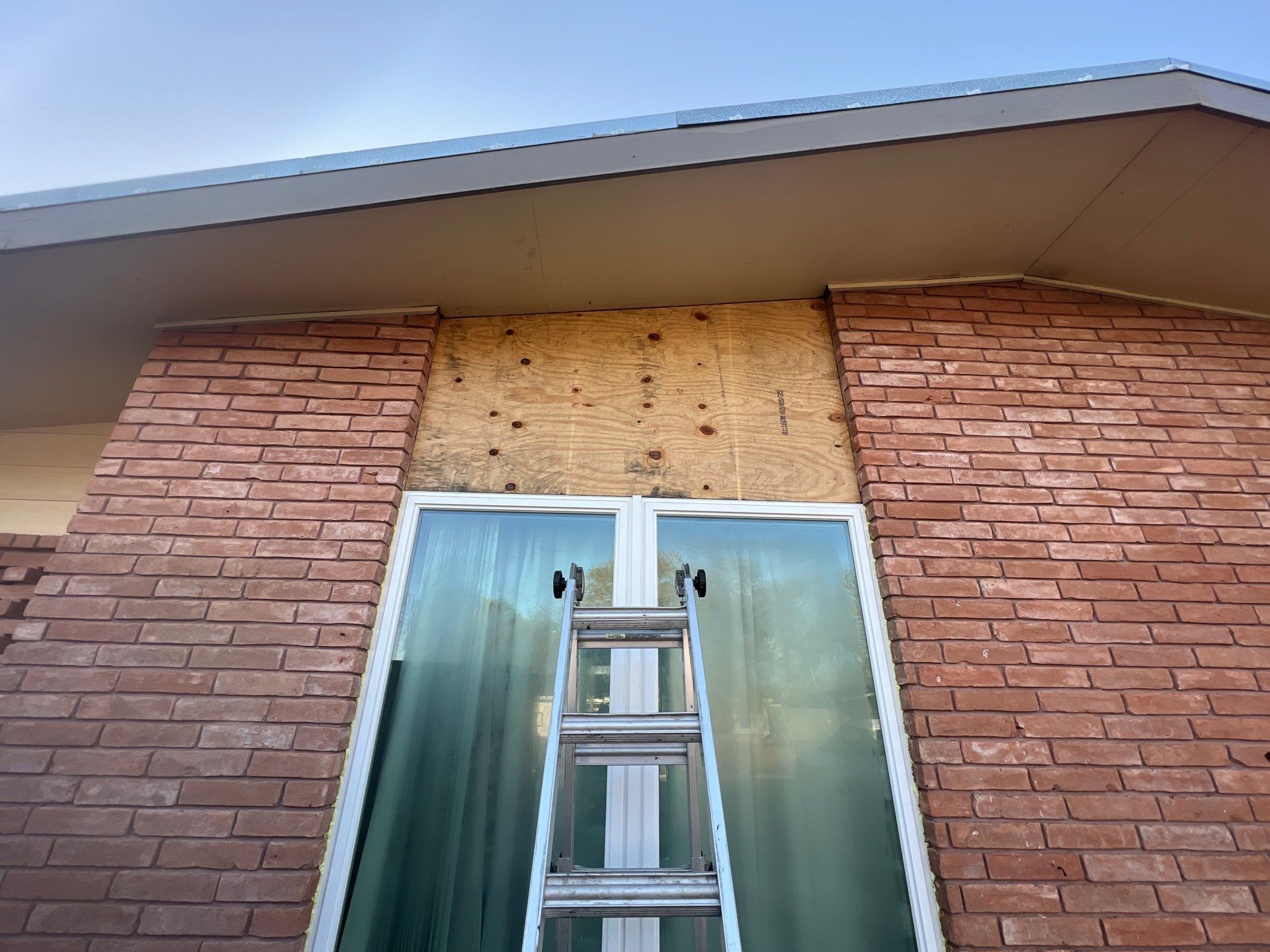 Windows in Brick with a Bay Window by Bayfront Roofing and Construction