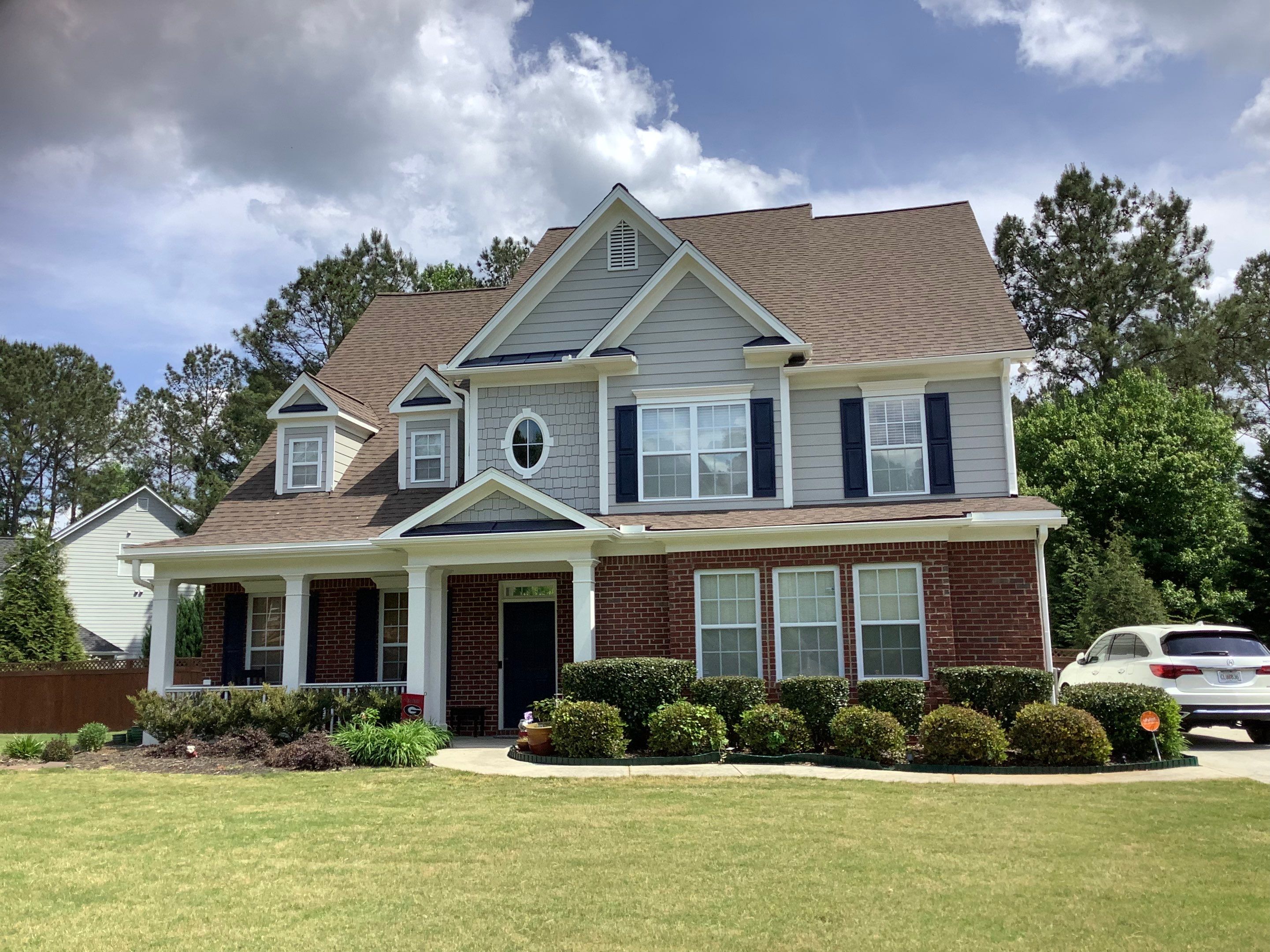 Exterior Home Refresh in Powder Springs with Gray Siding and White Trim by Swift Home Renovations