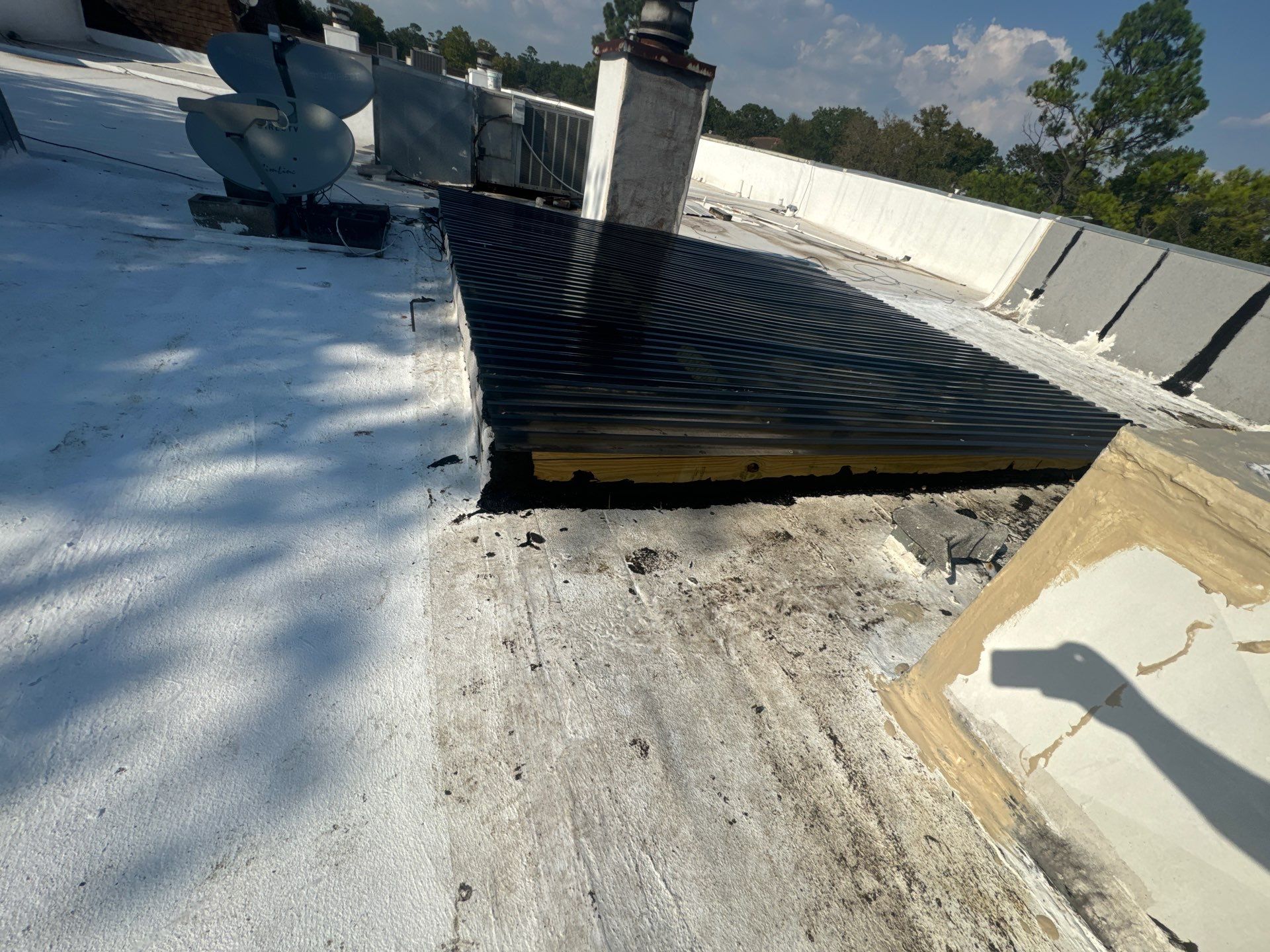 Waterproofing AC Curb covered courtyard on a flat Roof by Associates Roofing Unlimited