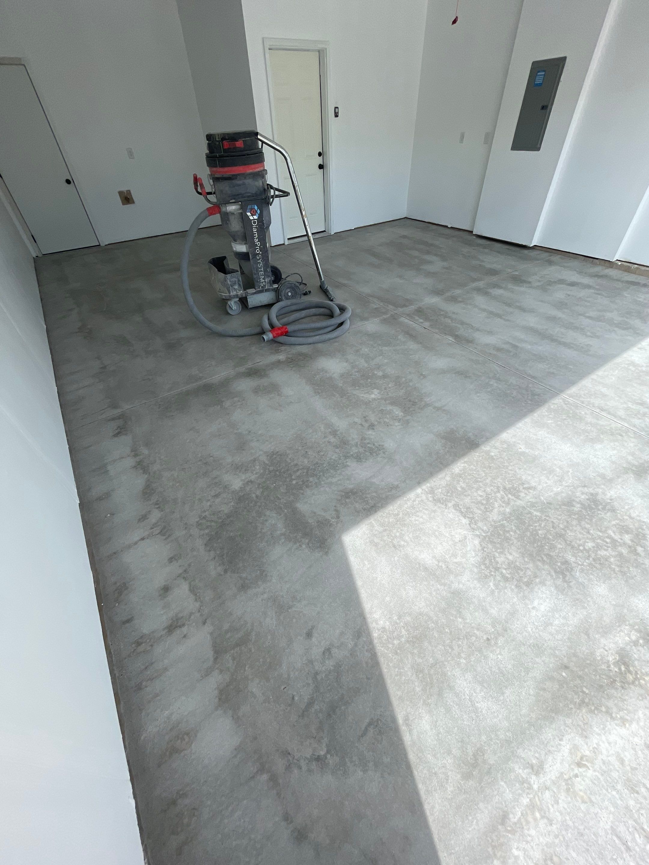 Sioux Falls Garage Floor Transformation with Cabin Fever Decorative Chips by Select Painting, Coatings & Garage Cabinets