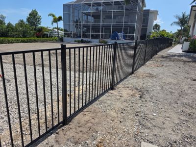 Black Aluminum Fencing and Paver Walkway Installation in Punta Gorda