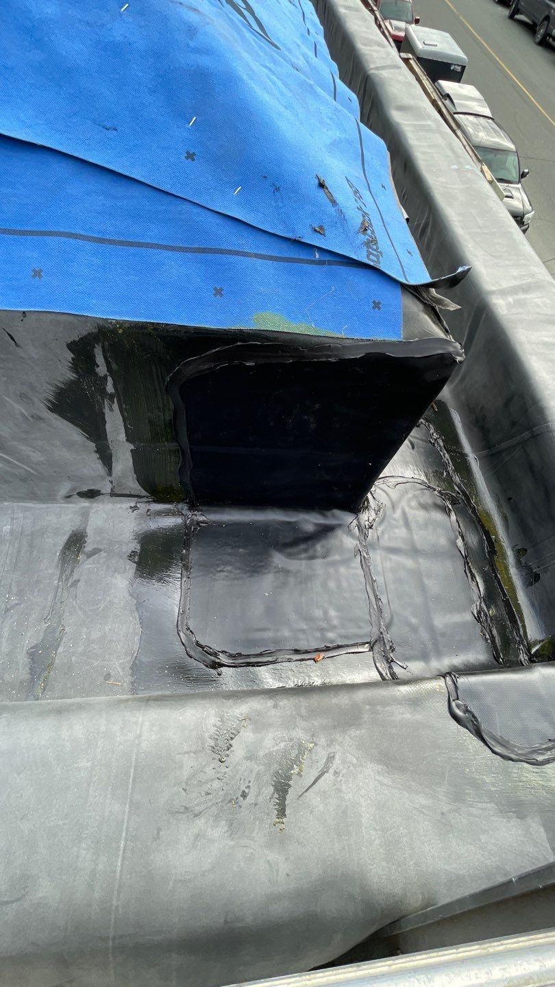 Commercial Roofing Installation using 12" Prolok metal and hidden gutters! by Top Notch Roofing Inc