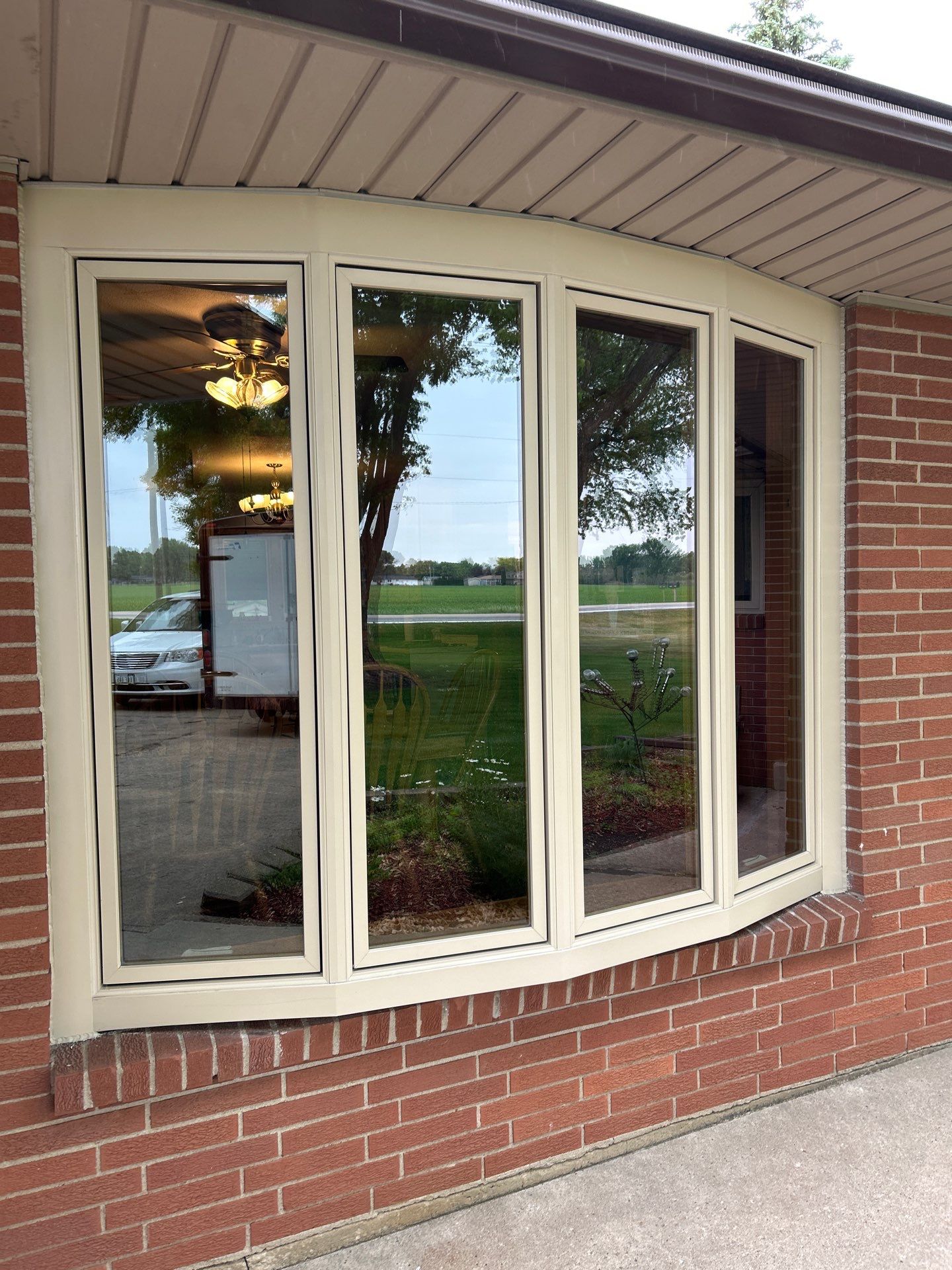Bow window replacment  using Pella Lifestyle wood/Aluminum window by United Windows and Siding LLC
