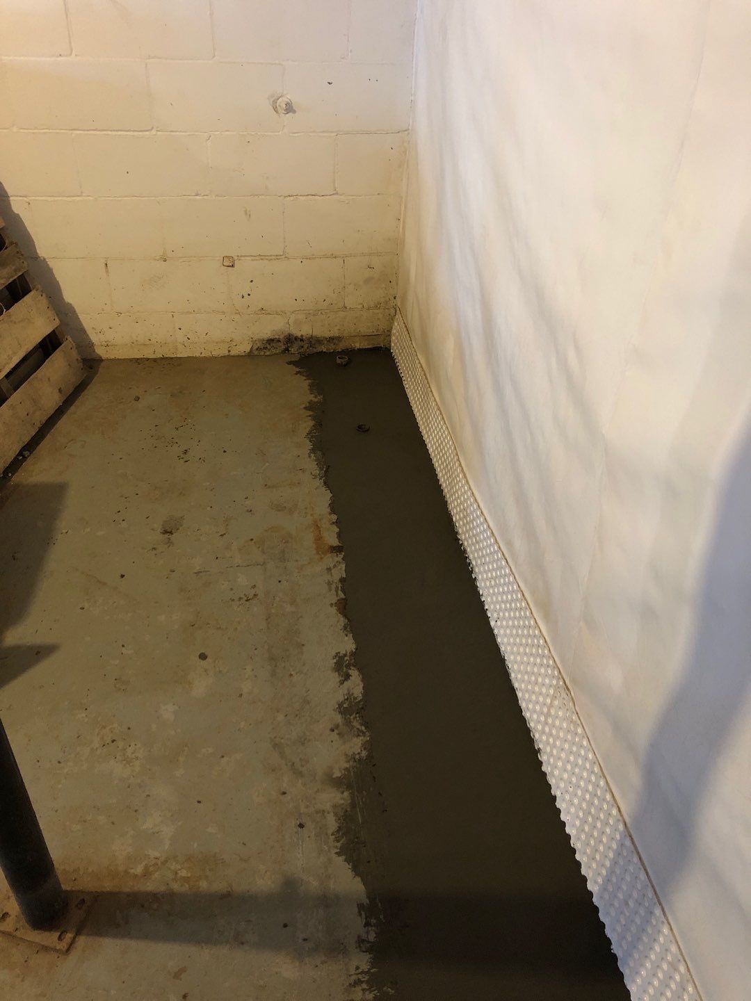 Basement Waterproofing using Drain tile system and a foundation wrap by ACE Waterproofing & Basement Solutions